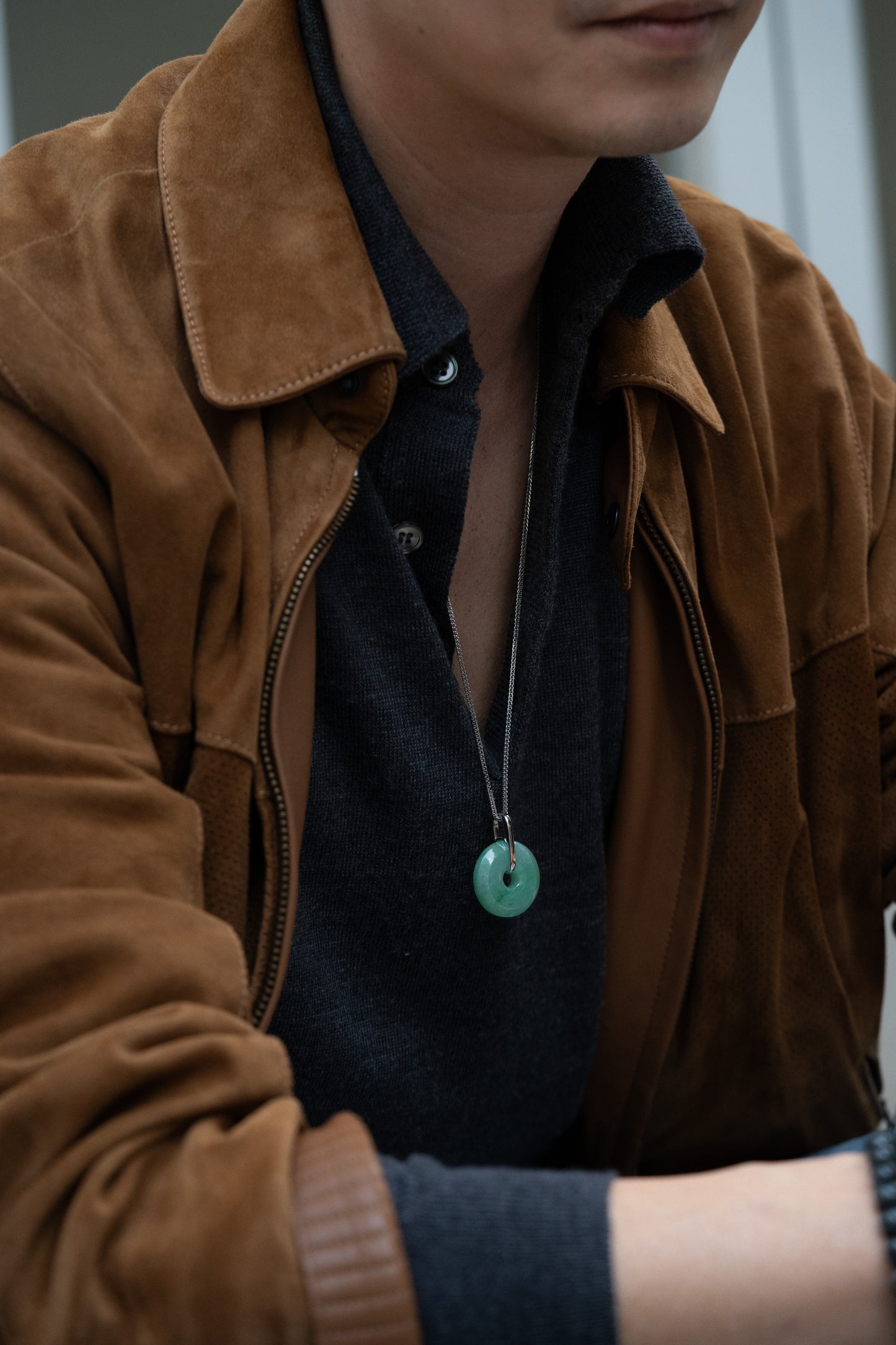 Pale Green Jadeite Zen Doughnut Pendant with Light Green patches added with a Platinum Loop hung on a 925 Silver Chain
