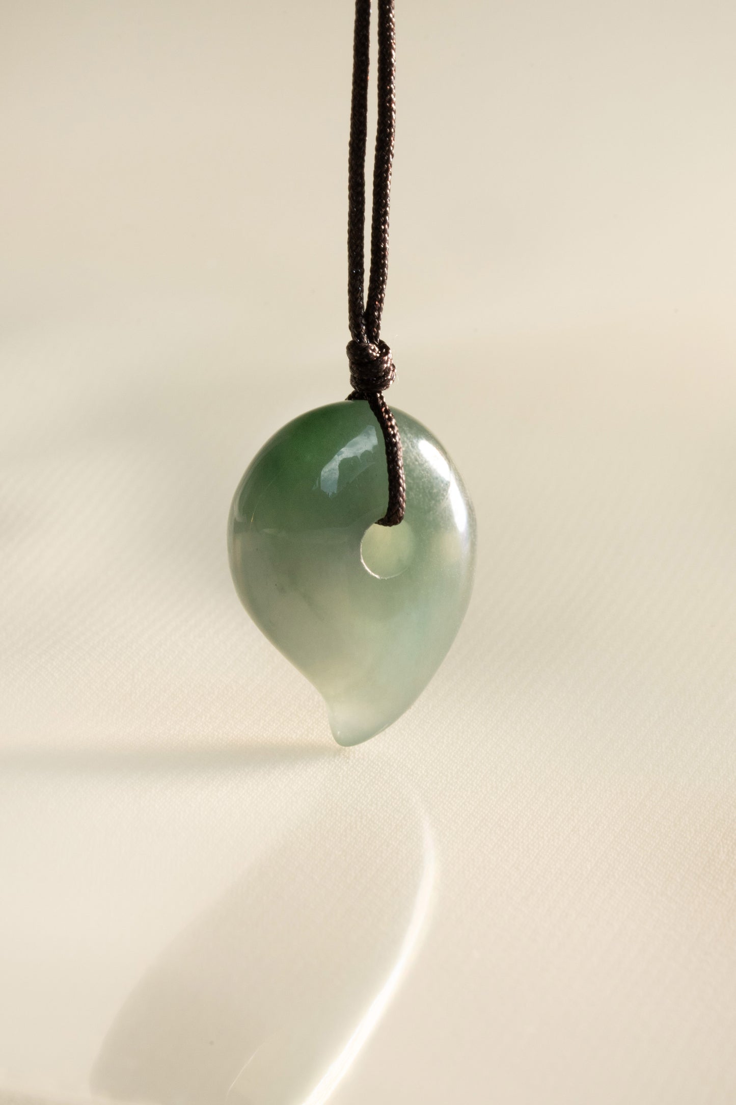 Pale Bluish Green Jadeite Comma with White patches