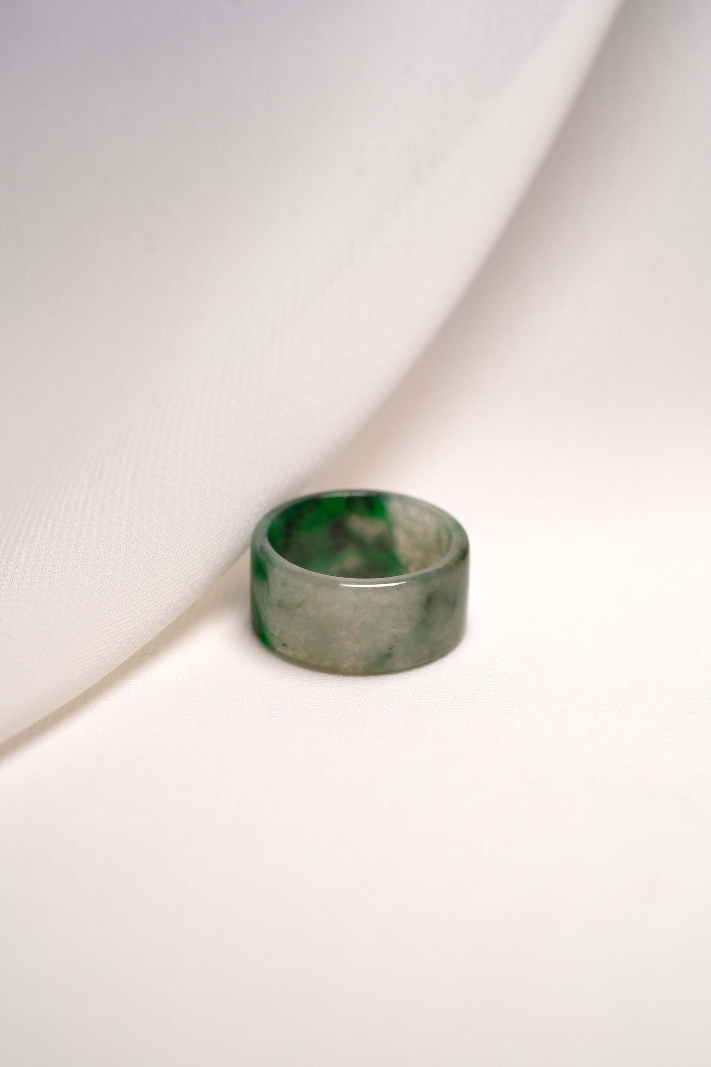 White Jadeite Ring with Medium Green and Black Patches