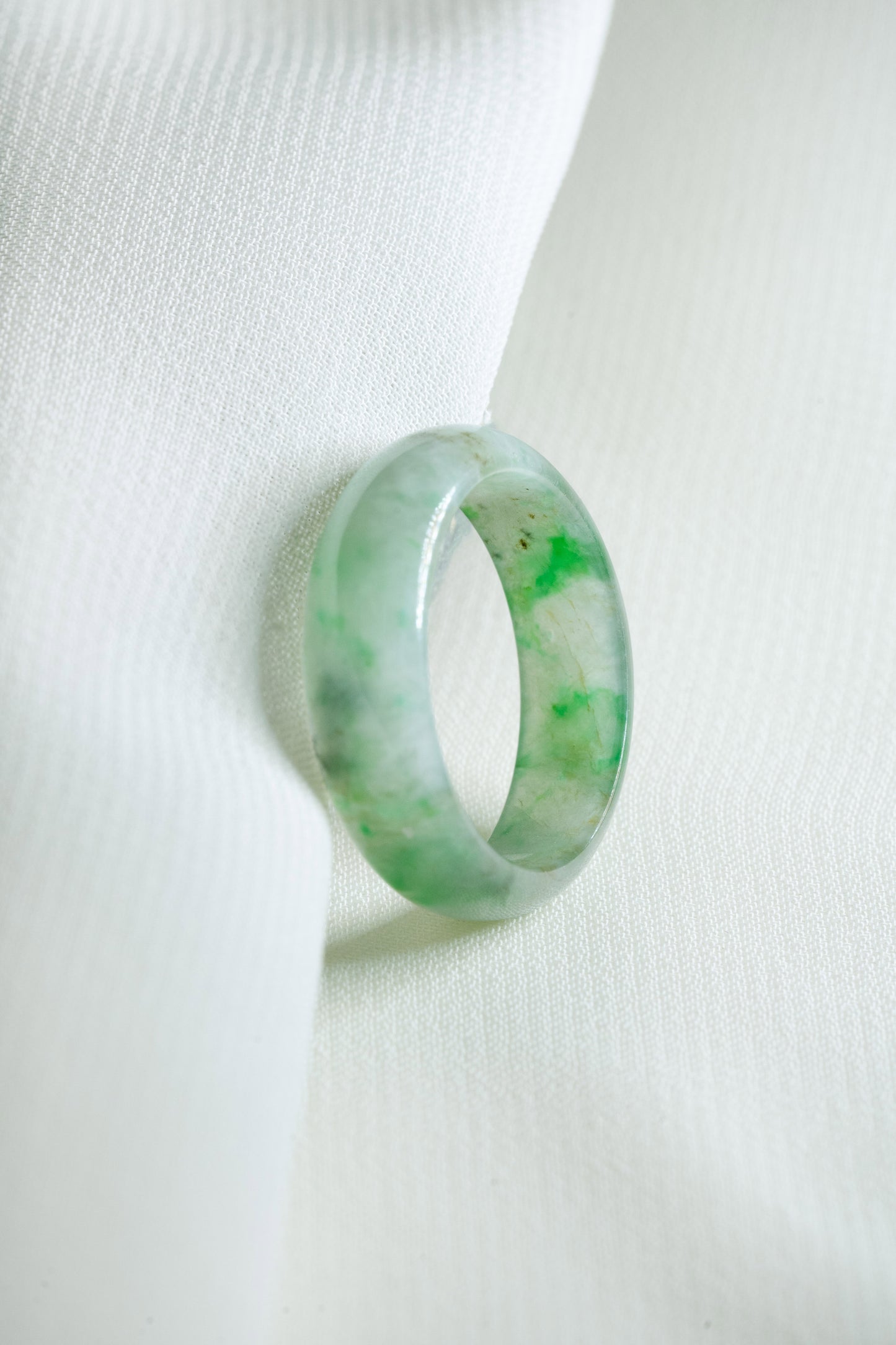 Intense Green Jadeite Ring with Pale Green patches