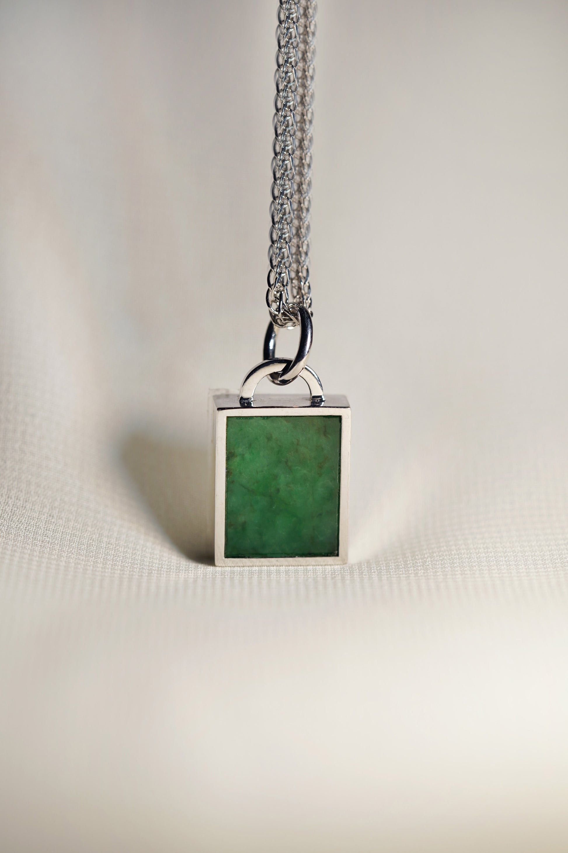 Intense Green Jadeite Tag with 18K White Gold Pendant hung on a 925 Silver Chain