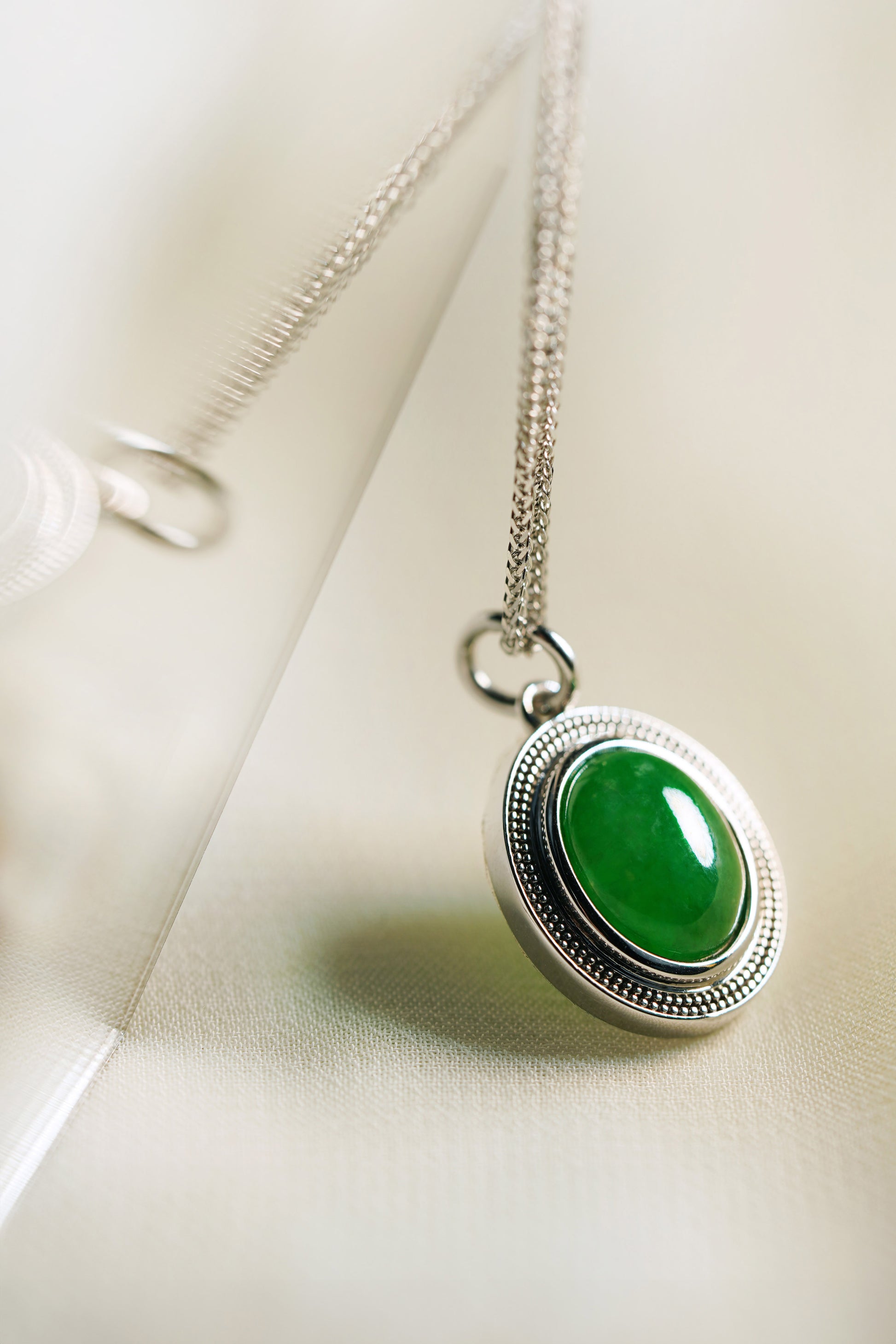 Oval Intense Green Jadeite with 18K White Gold Pendant hung on a 925 Silver Chain