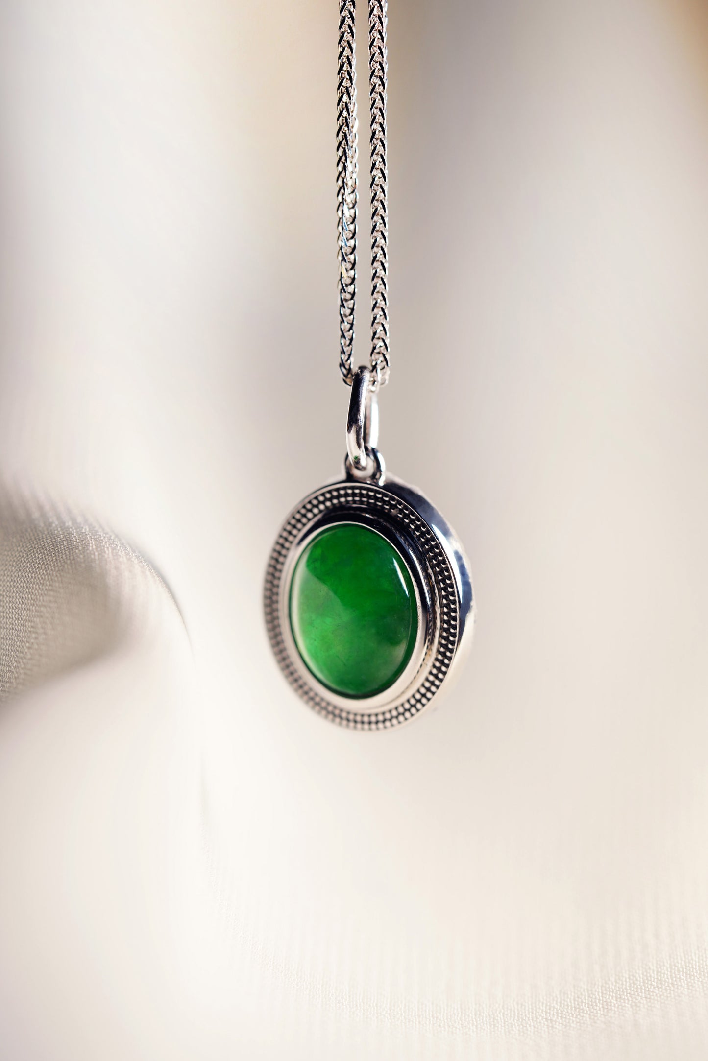 Oval Intense Green Jadeite with 18K White Gold Pendant hung on a 925 Silver Chain