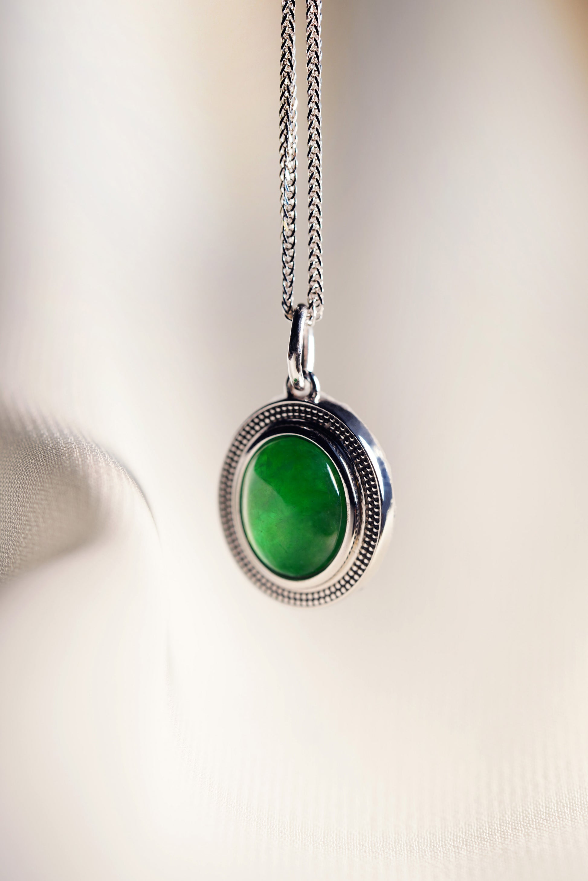 Oval Intense Green Jadeite with 18K White Gold Pendant hung on a 925 Silver Chain