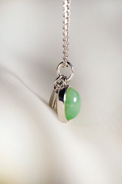 Oval Pale Green Jadeite with Light Green patches with 18K White Gold Pendant hung on a 925 Silver Chain