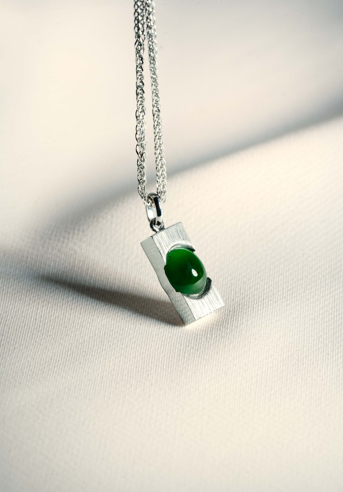 Pale Green Jadeite with Light Green patches with 18K White Gold Pendant hung on a 925 Silver Chain