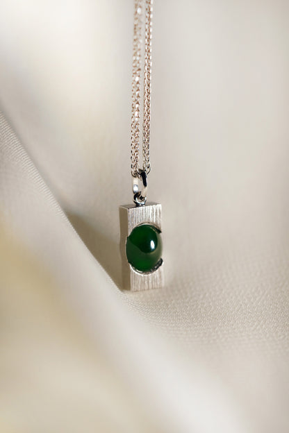 Pale Green Jadeite with Light Green patches with 18K White Gold Pendant hung on a 925 Silver Chain