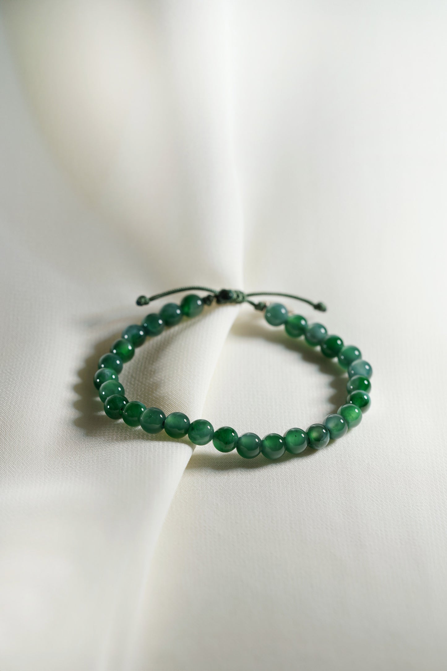Pale Bluish Green Jadeite Bead Bracelet with Deep Green patches