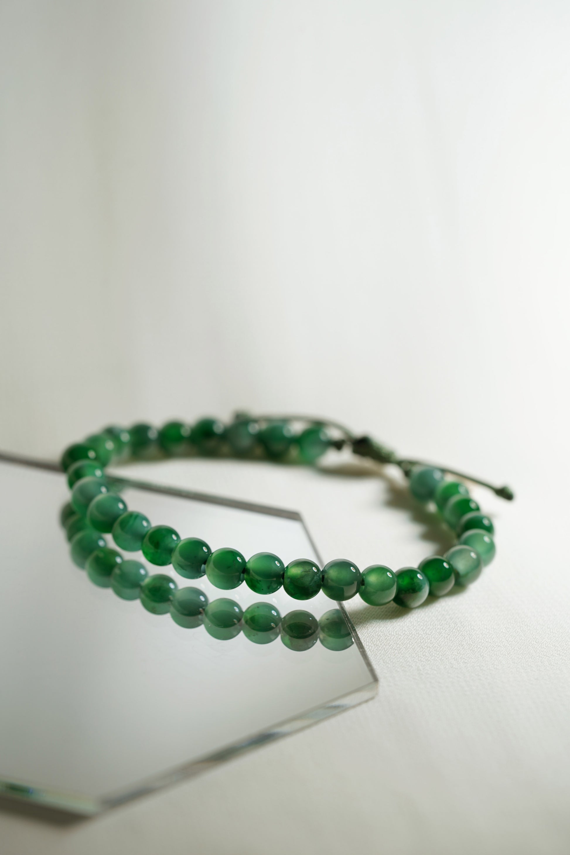 Pale Bluish Green Jadeite Bead Bracelet with Deep Green patches