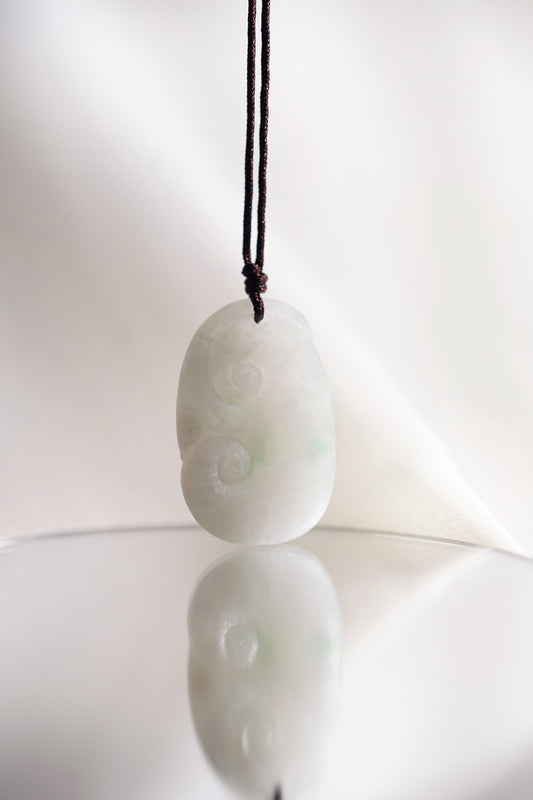 Carved White Jadeite Ruyi Pendant with Bright Green Patches