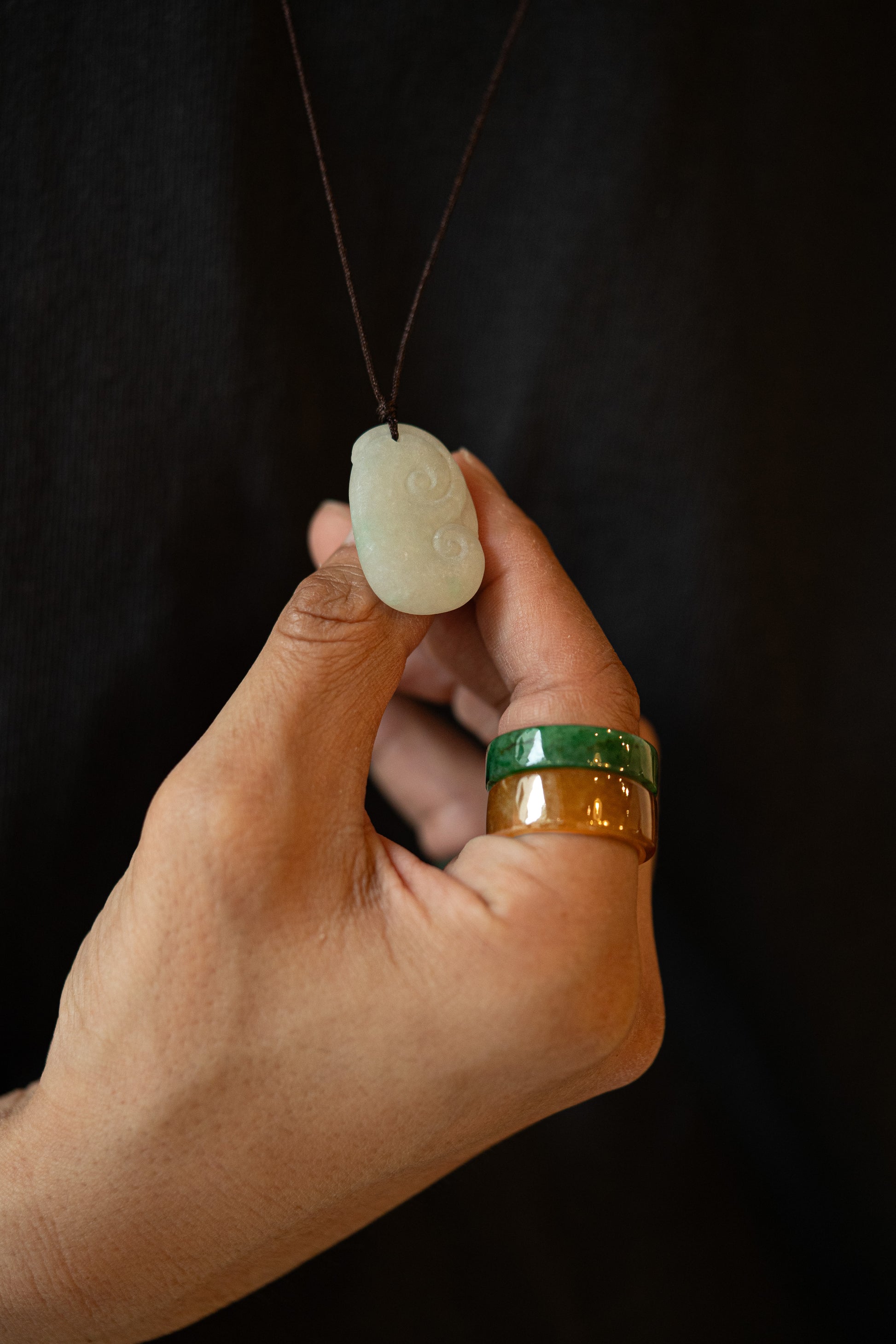 Carved White Jadeite Ruyi Pendant with Bright Green Patches