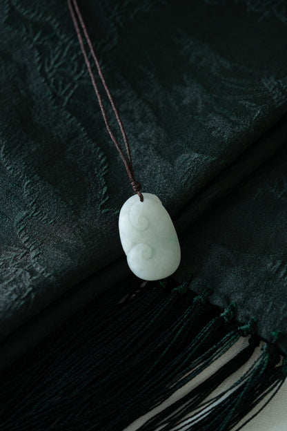Carved White Jadeite Ruyi Pendant with Bright Green Patches