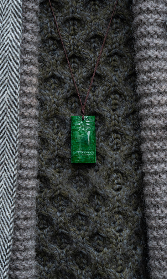 Carved Intense Green Jadeite Pendant with Pale Green patches