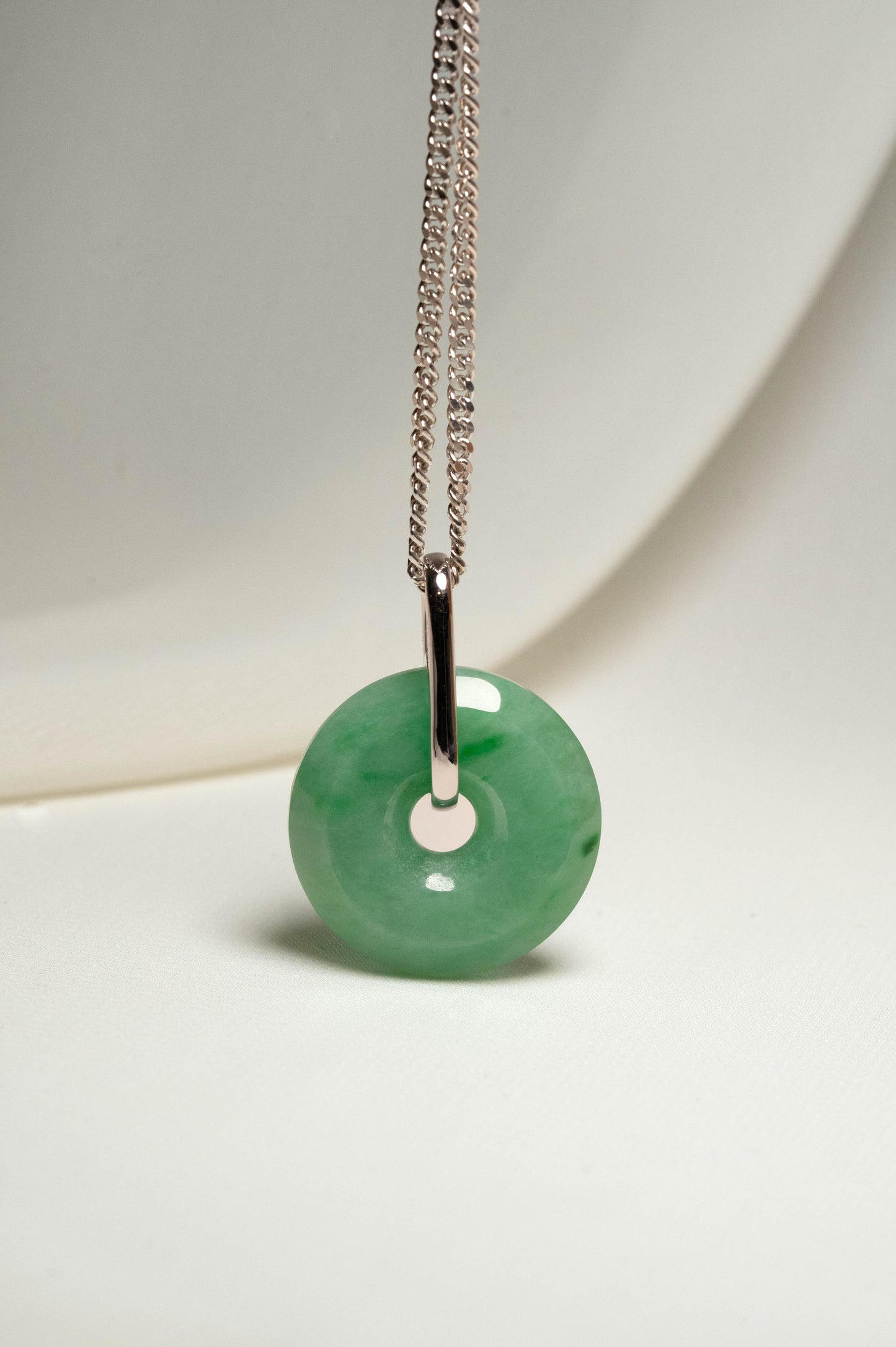 Pale Green Jadeite with Medium and Intense Green patches Zen Doughnut Pendant with 14K White Gold Loop hangs on a 925 Silver Chain