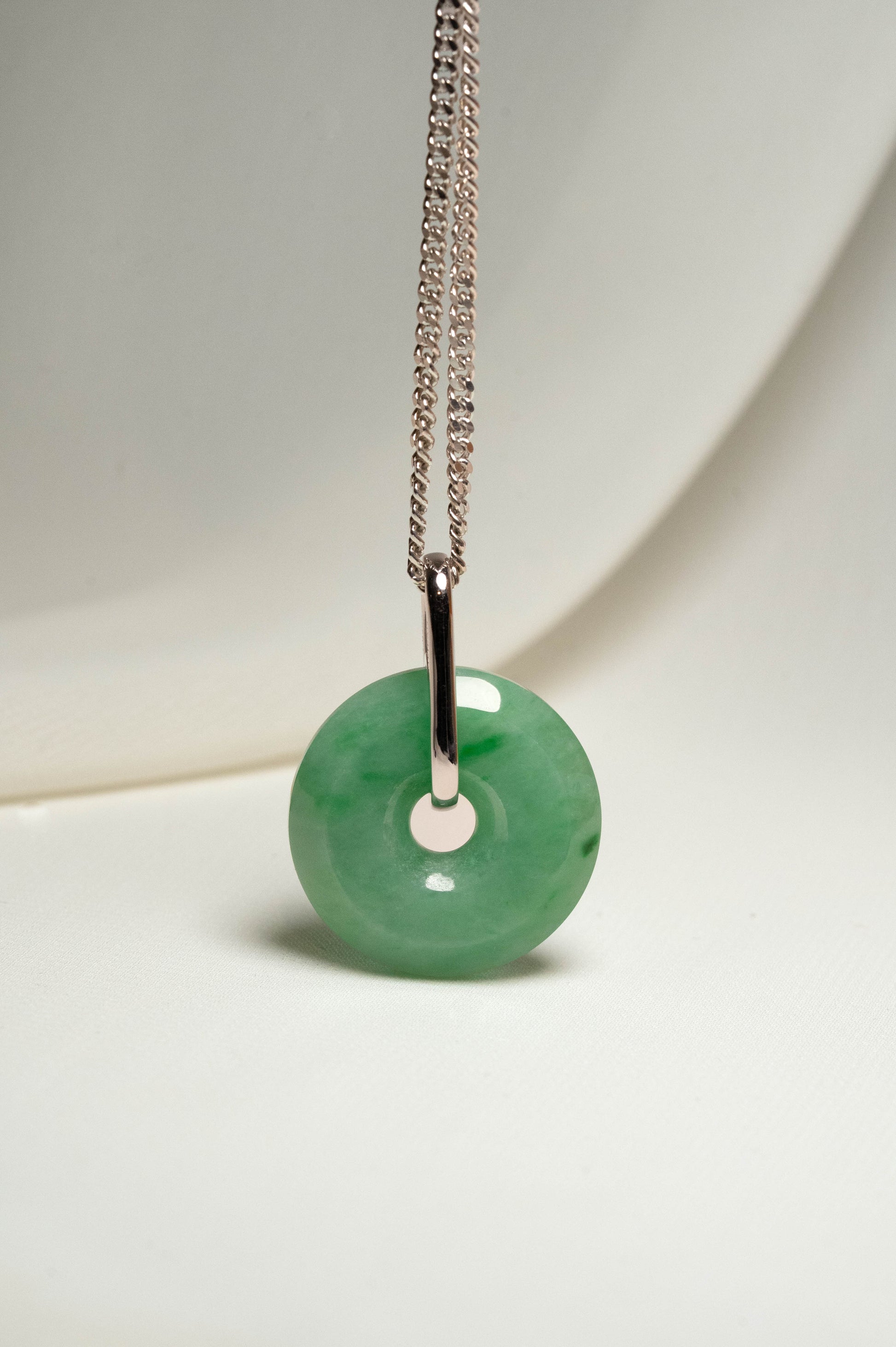 Pale Green Jadeite with Medium and Intense Green patches Zen Doughnut Pendant with 14K White Gold Loop hangs on a 925 Silver Chain