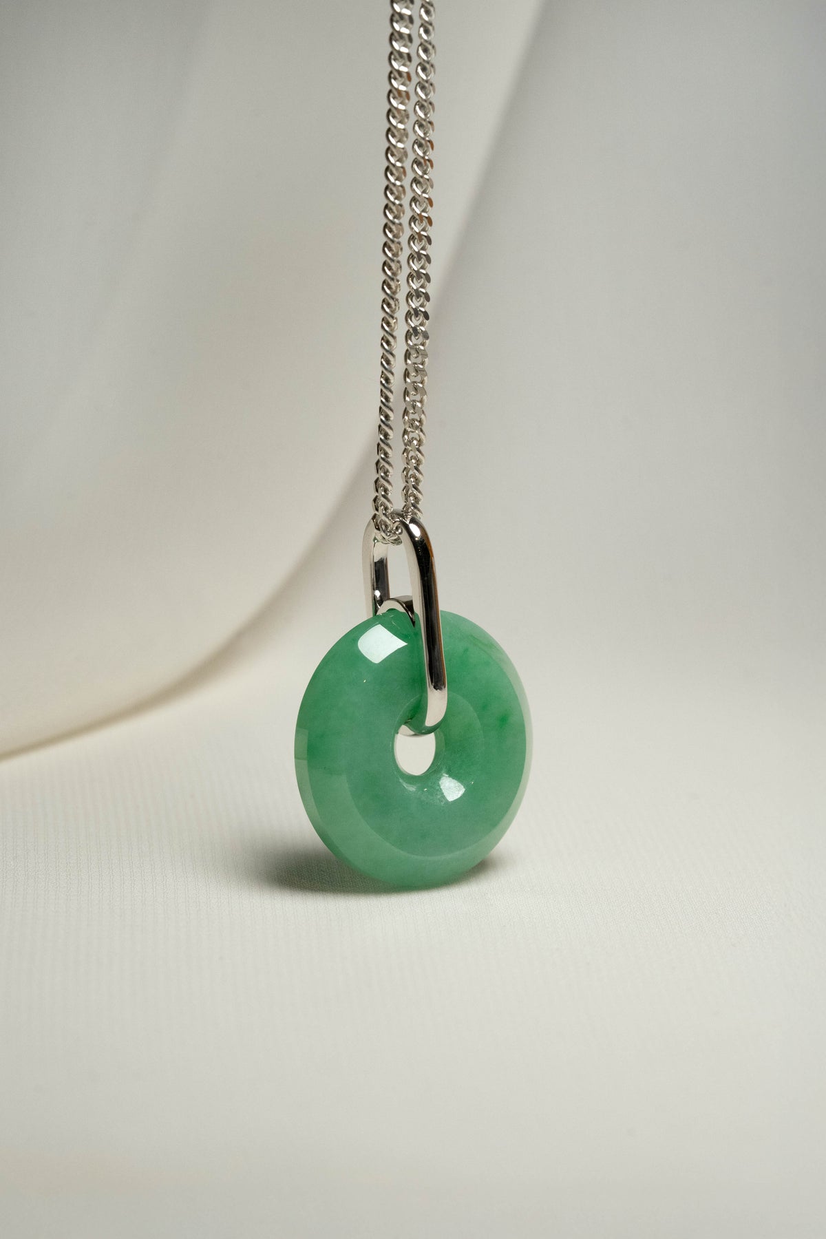 Pale Green Jadeite with Medium and Intense Green patches Zen Doughnut Pendant with 14K White Gold Loop hangs on a 925 Silver Chain
