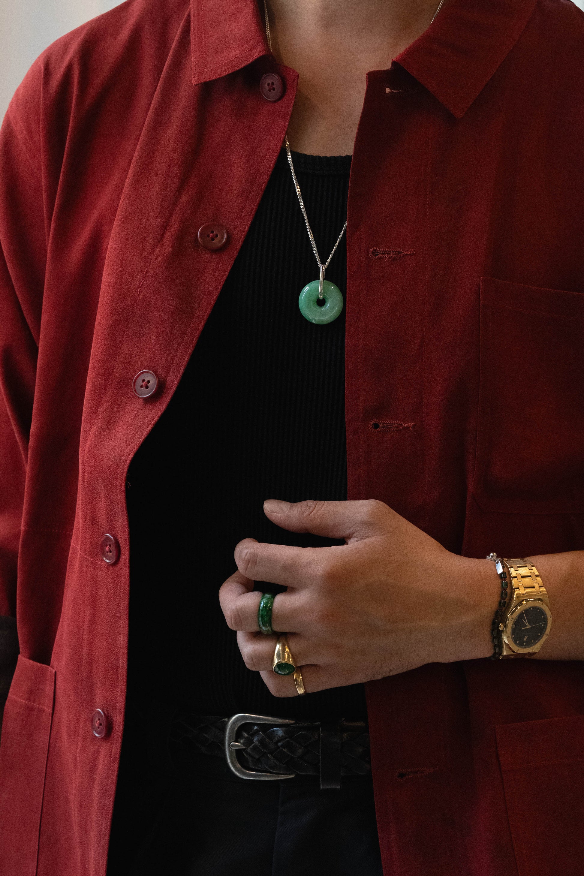 Pale Green Jadeite with Medium and Intense Green patches Zen Doughnut Pendant with 14K White Gold Loop hangs on a 925 Silver Chain matches with a Red Silk Shirt 
