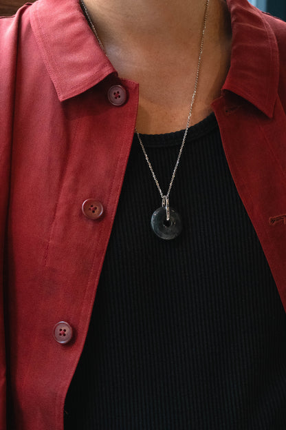 Grey Jadeite with Black patches Zen Doughnut Pendant with 14K White Gold Loop hangs on a 925 Silver Chain matches with a Red Silk Shirt 