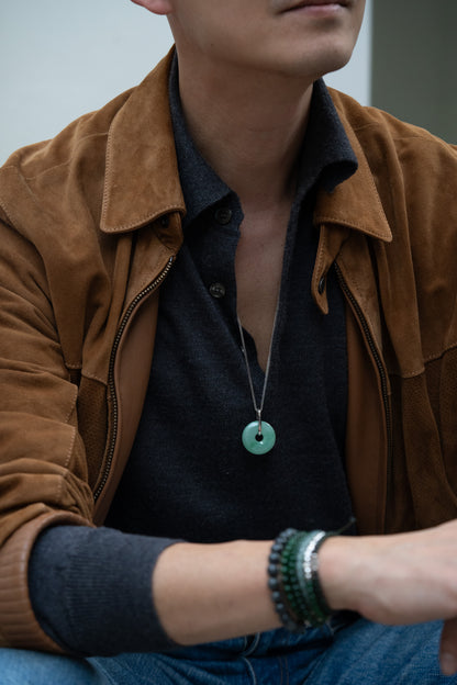 Pale Green Jadeite Zen Doughnut Pendant with Light Green patches added with a Platinum Loop hung on a 925 Silver Chain