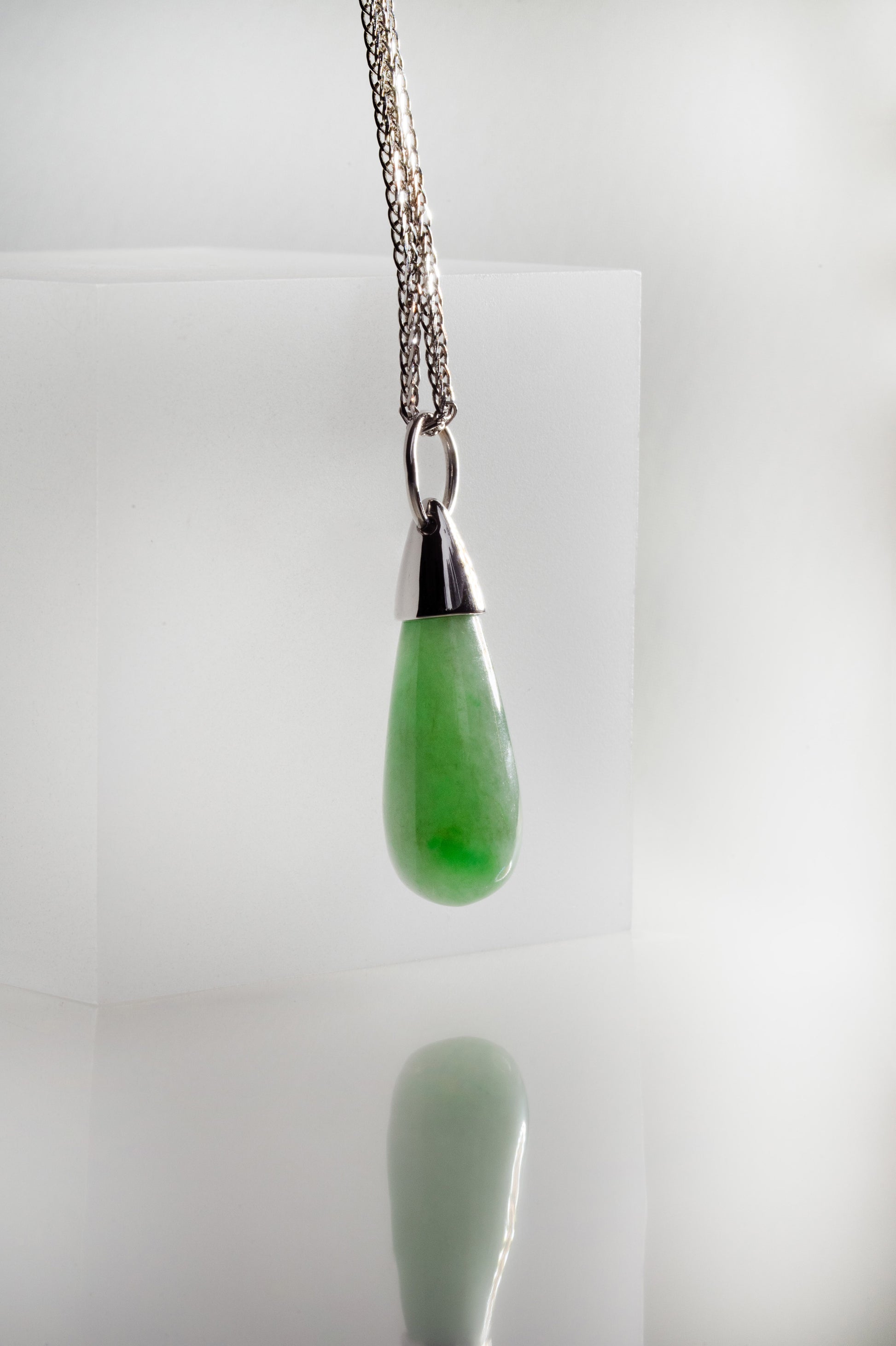 Pale Green Jadeite with Bright Green patches and 18K White Gold hung on a 925 Silver Chain
