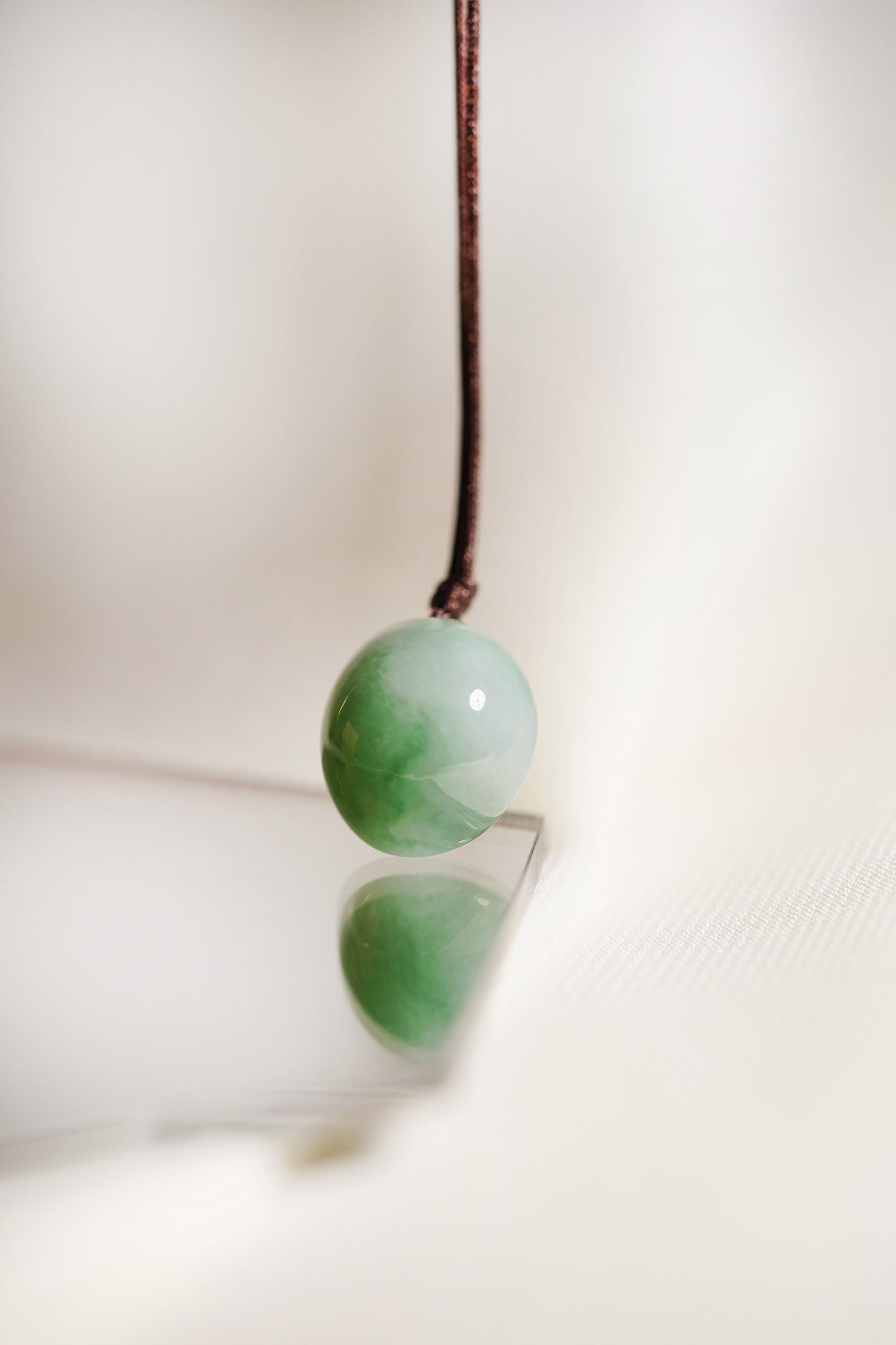 White Jadeite Egg Pendant with Yellowish Green patches