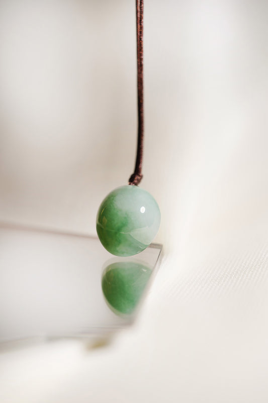 White Jadeite Egg Pendant with Yellowish Green patches