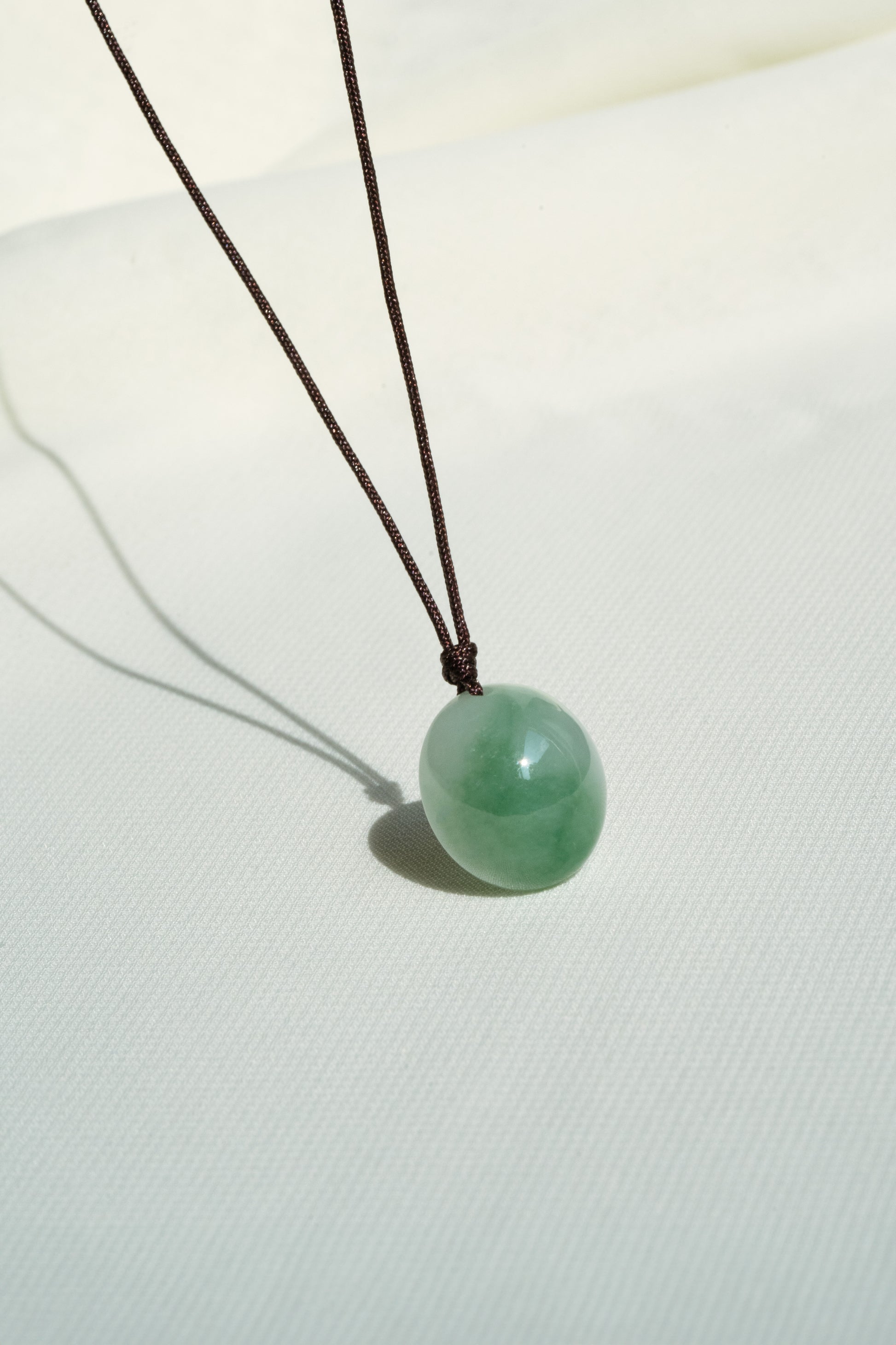 White Jadeite Egg Pendant with Yellowish Green patches