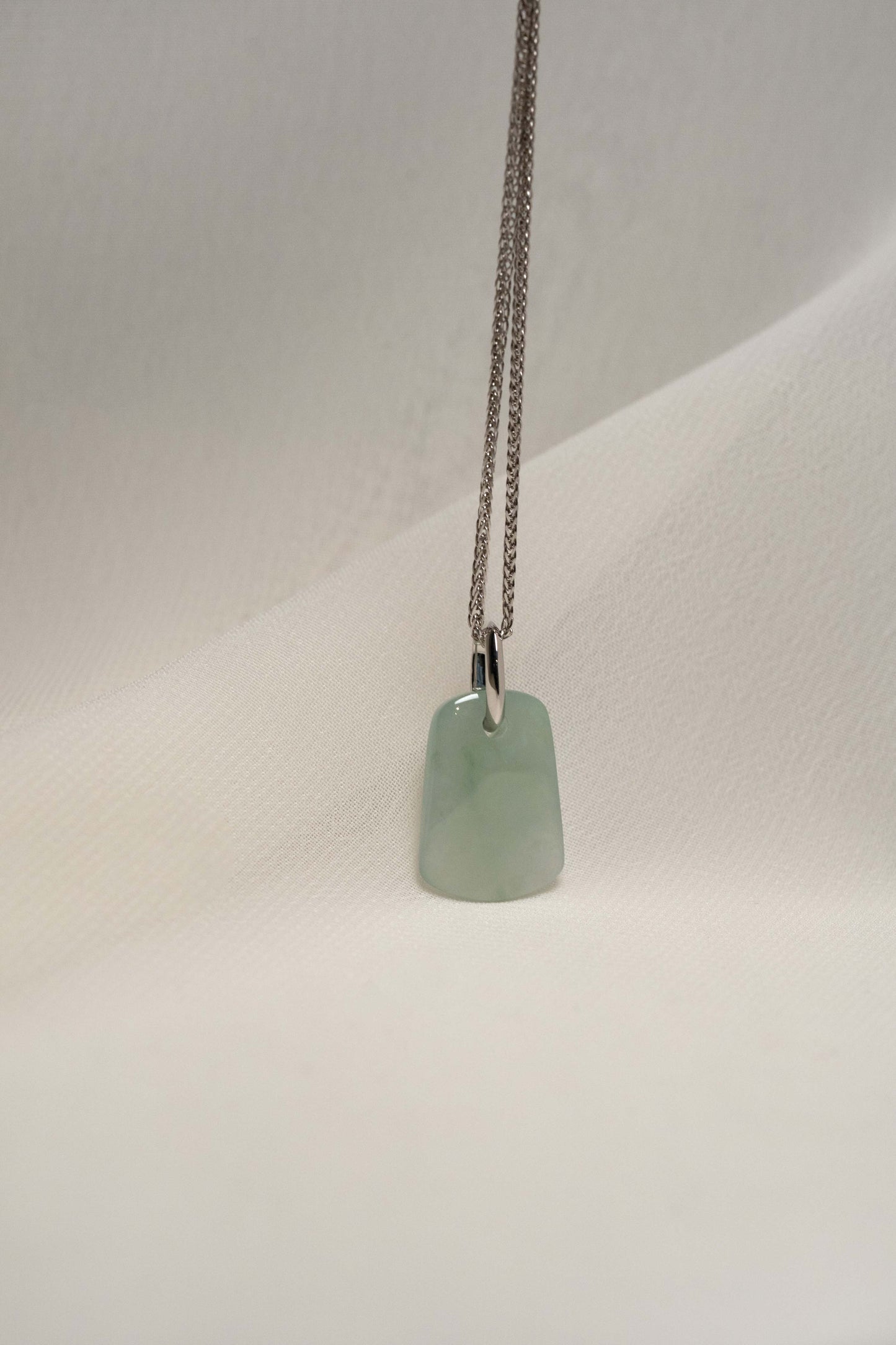 Pale Green Jadeite with Light Green Patches with Platinum Loop hung on a 925 Silver Chain