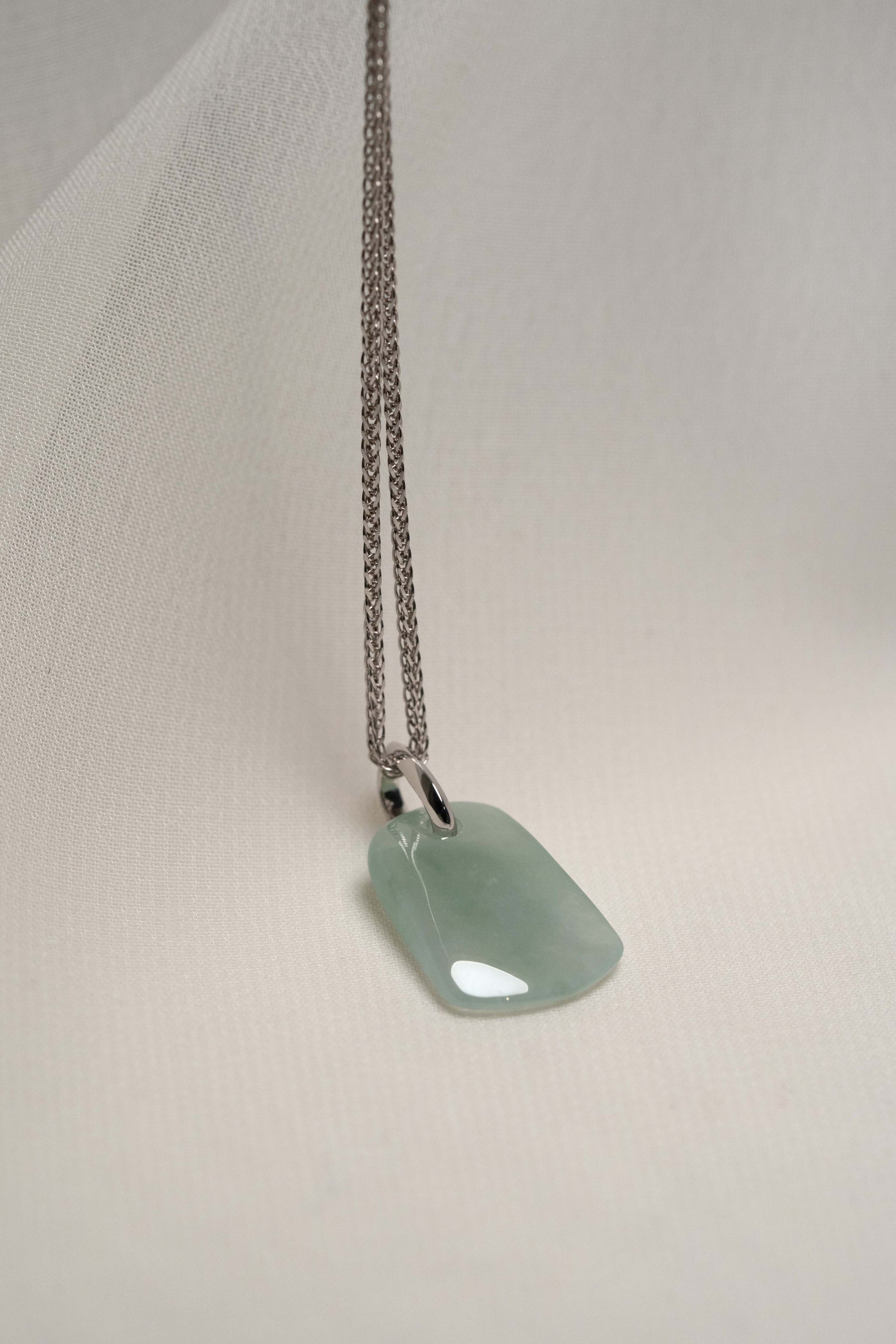 Pale Green Jadeite with Light Green Patches with Platinum Loop hung on a 925 Silver Chain