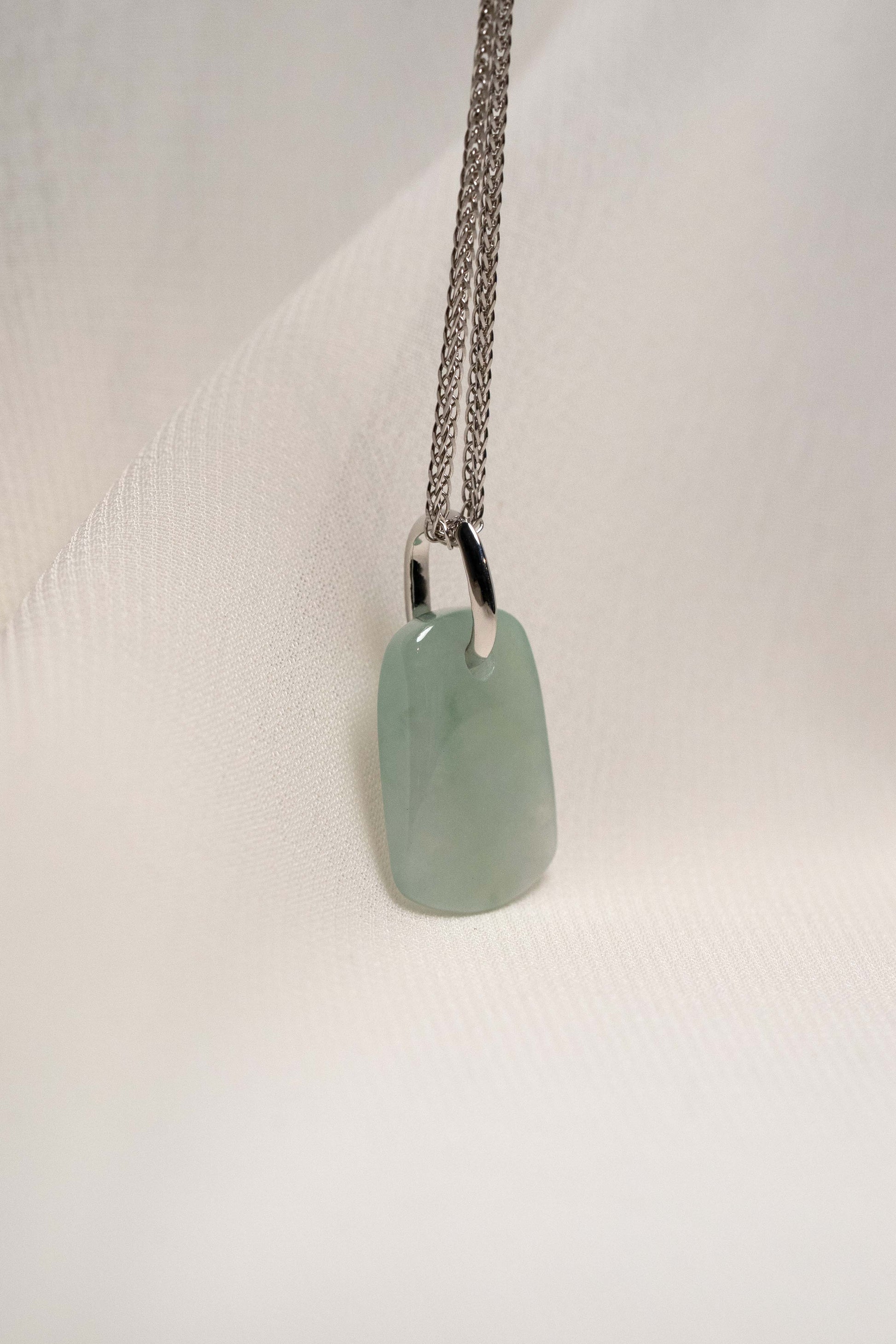 Pale Green Jadeite with Light Green Patches with Platinum Loop hung on a 925 Silver Chain