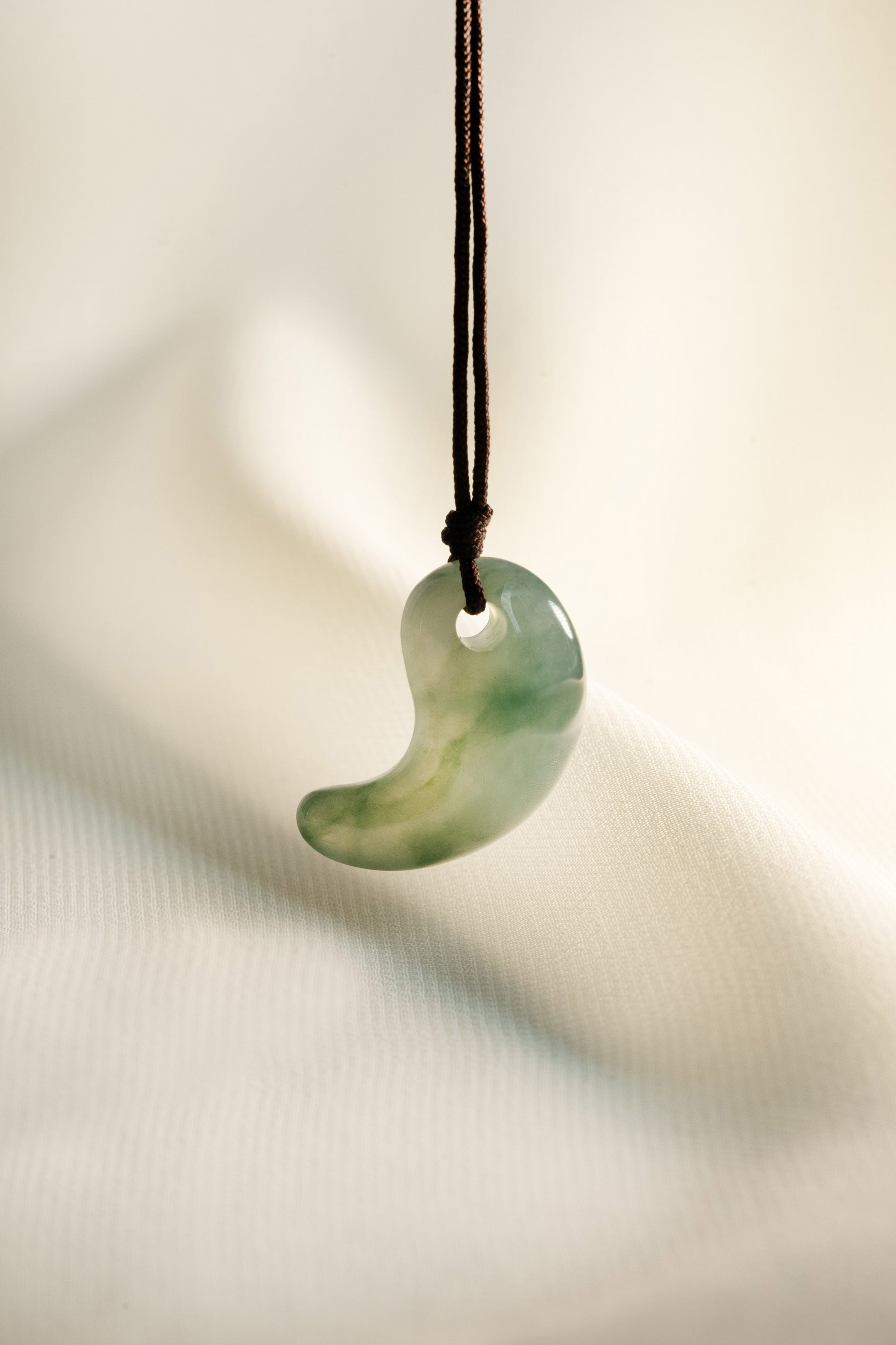 Light Bluish Green Jadeite Comma with Medium Bluish Green patches