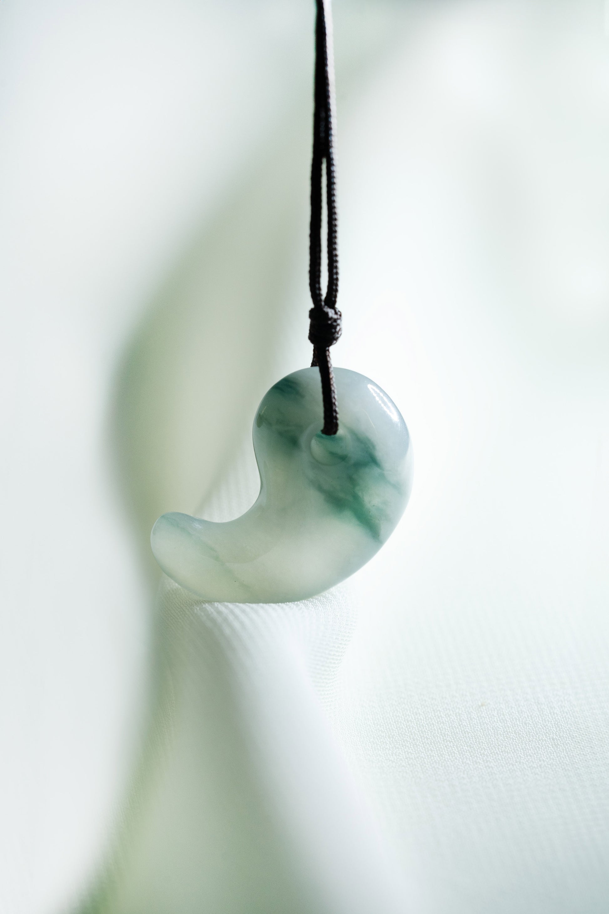 Pale Bluish Green Jadeite Comma with Medium Bluish Green patches