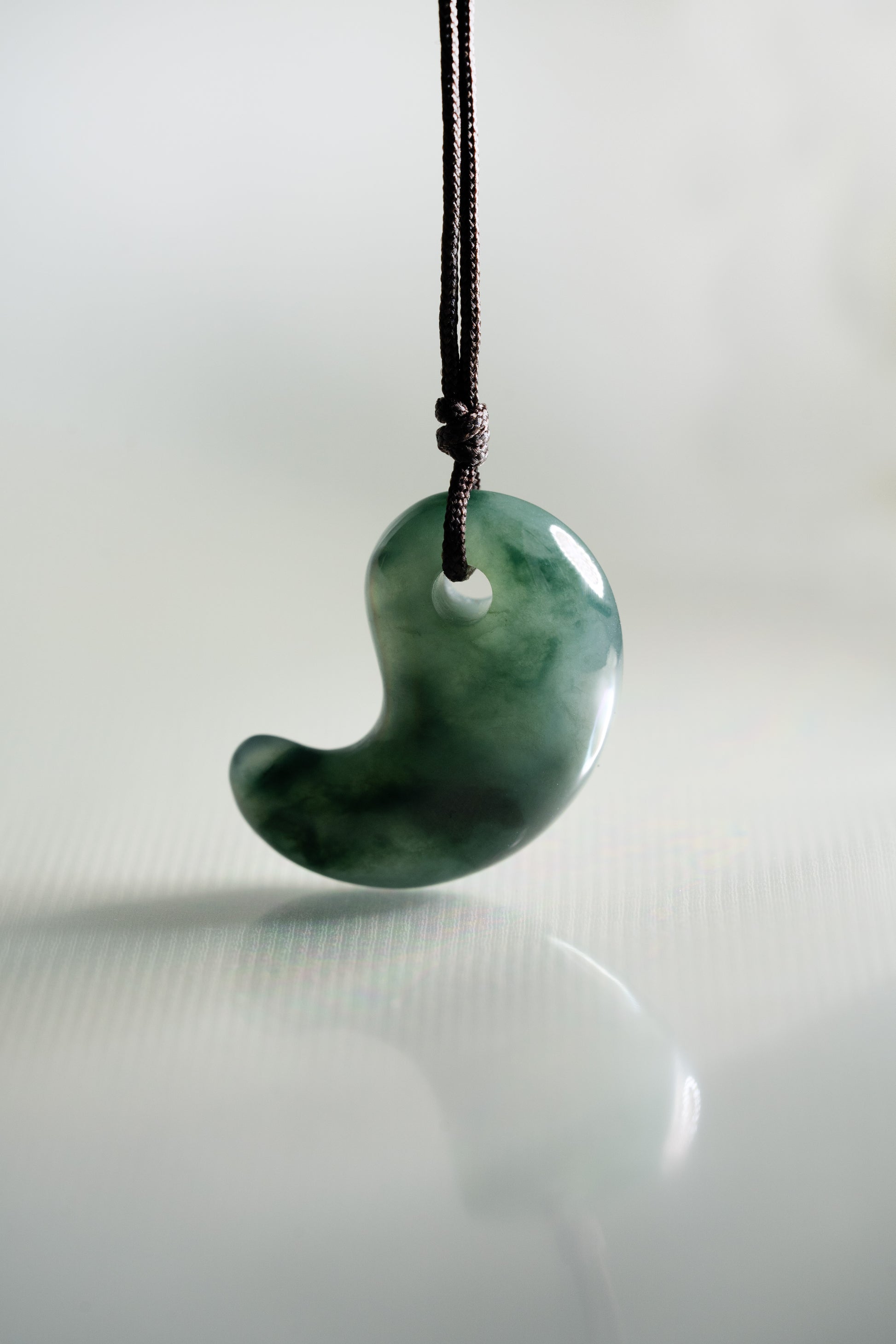 Deep Bluish Green Jadeite Comma with Medium Bluish Green patches