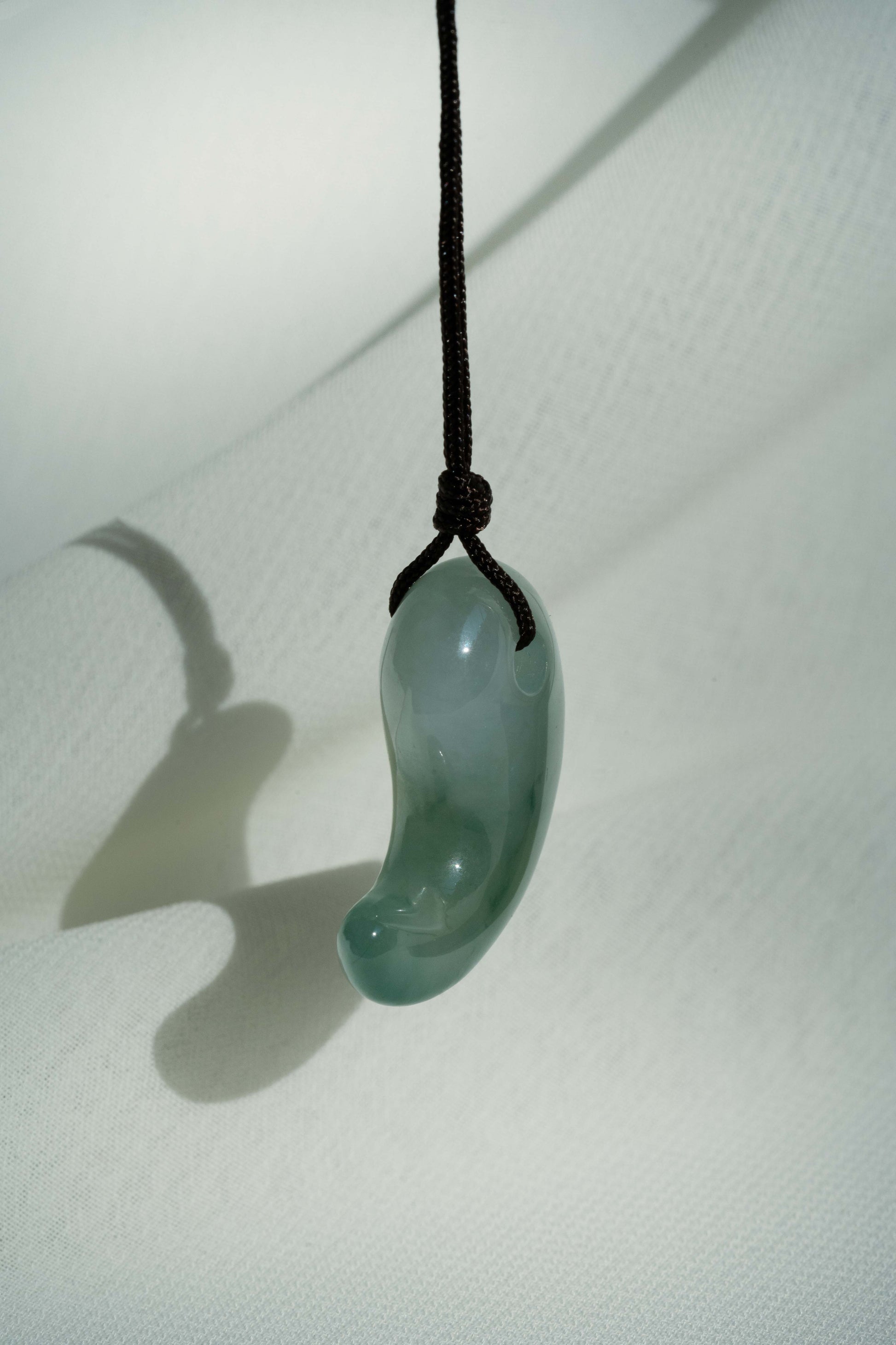 White Jadeite Comma with Bluish Green patches