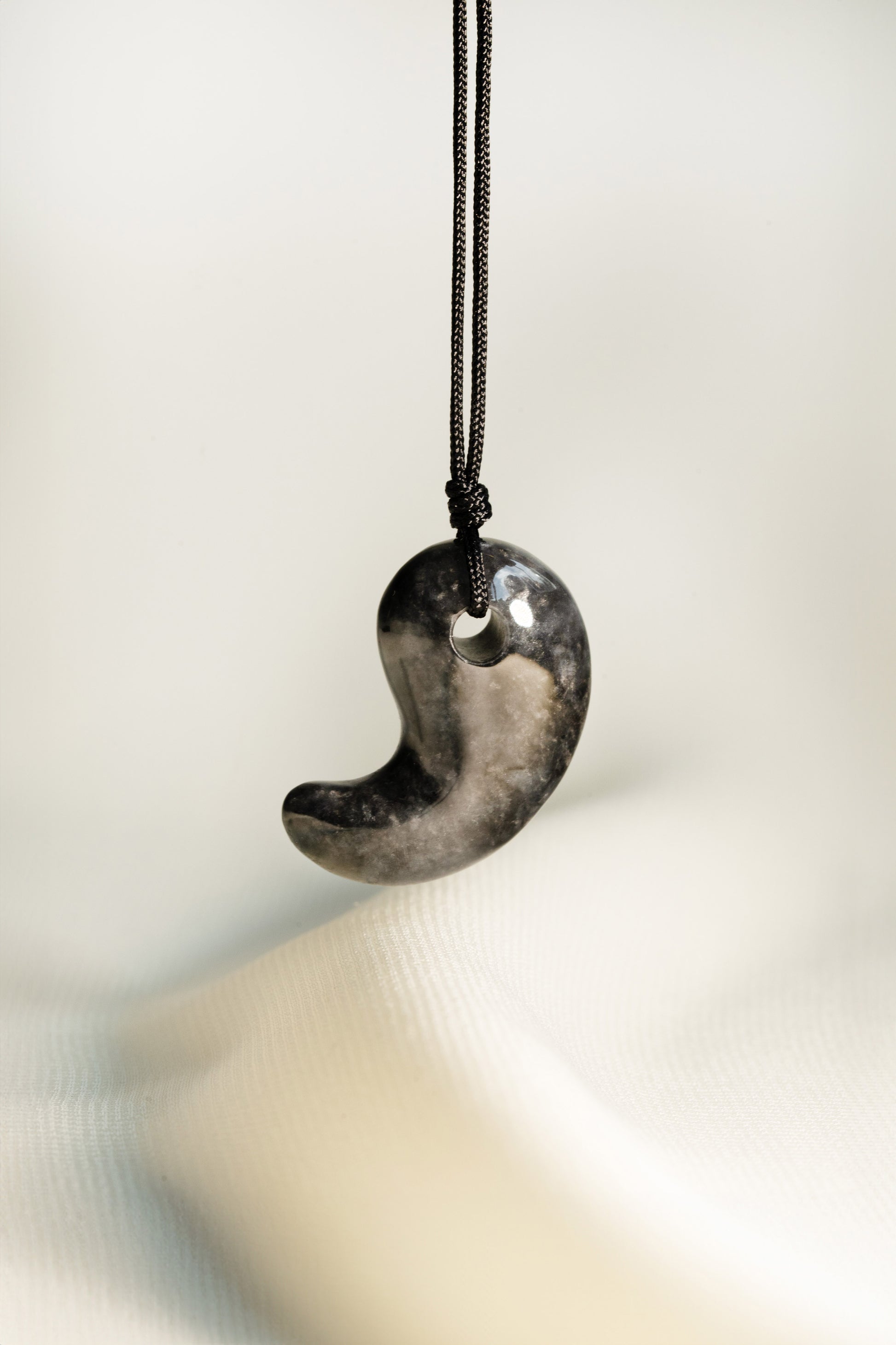 Black Jadeite Comma with Grey spots