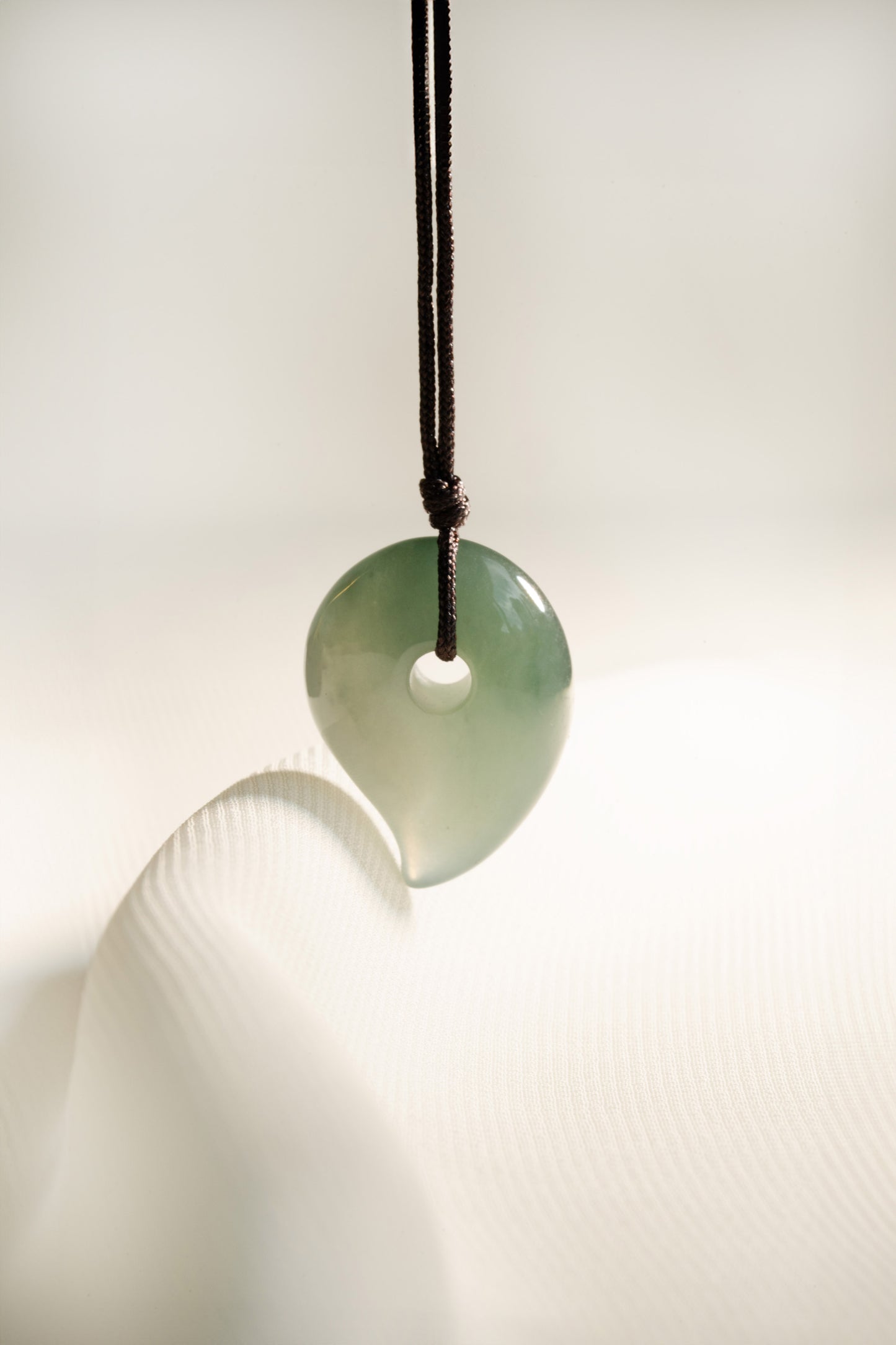 Pale Bluish Green Jadeite Comma with White patches