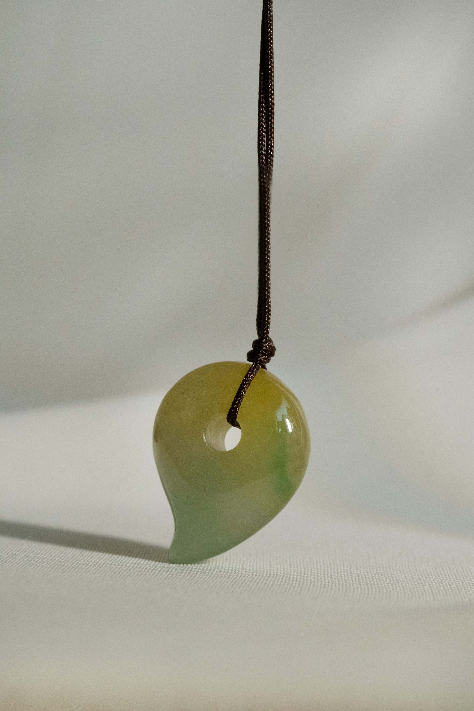White Jadeite Comma with Light Green and Brownish Yellow Patches