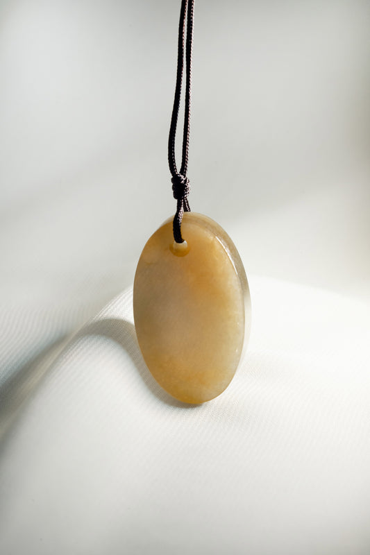 Oval Brownish Yellow Jadeite Tag with White patches