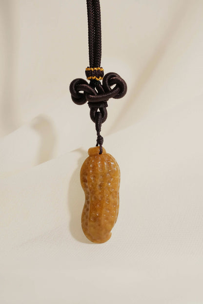 Jadeite Carved Peanut hung on a knot string