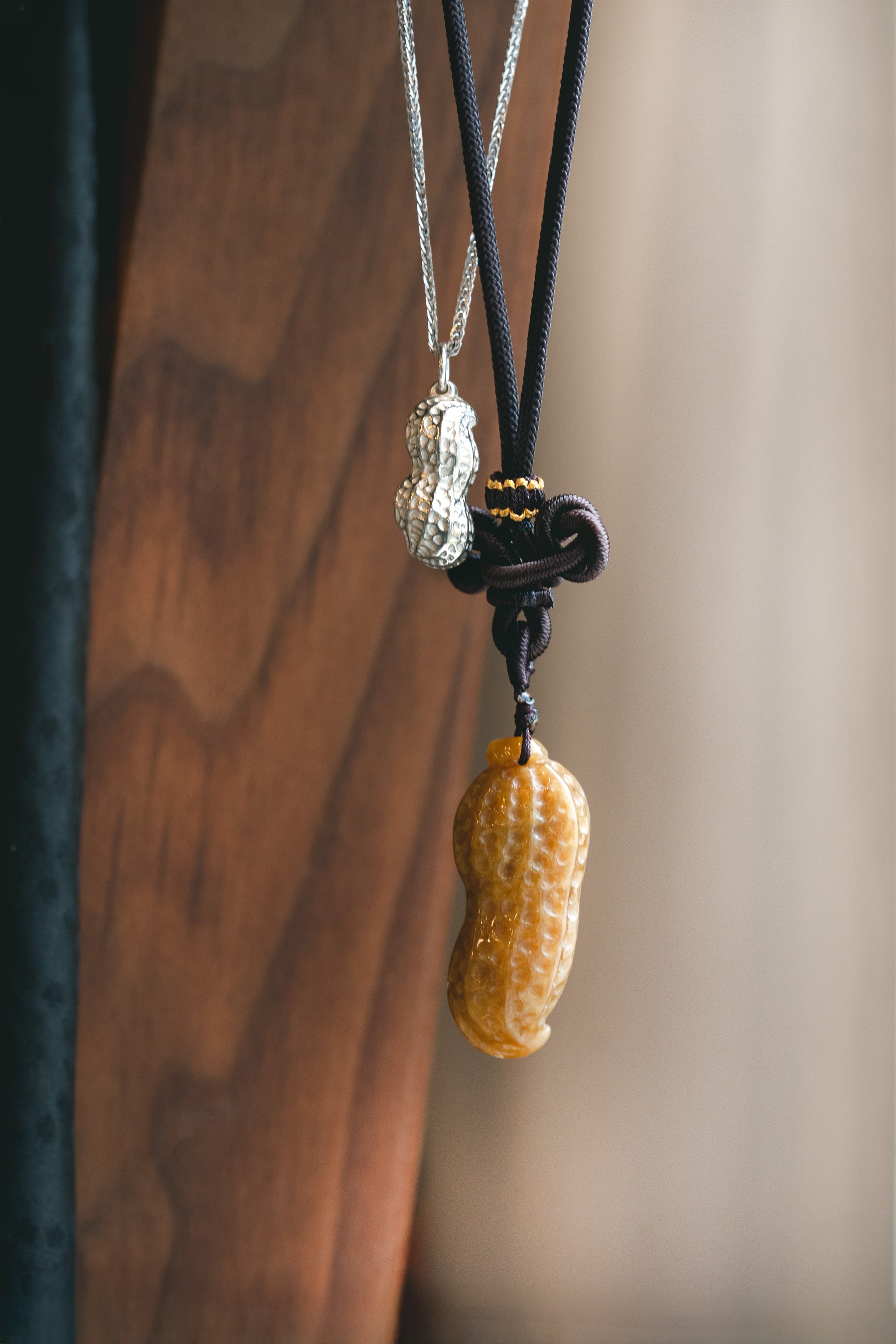 Jadeite Carved Peanut hung on a knot string and Silver Peanut 