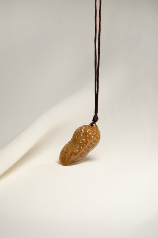 Brownish Yellow Carved Jadeite Peanut Pendant in Small Size with Adjustable Knot