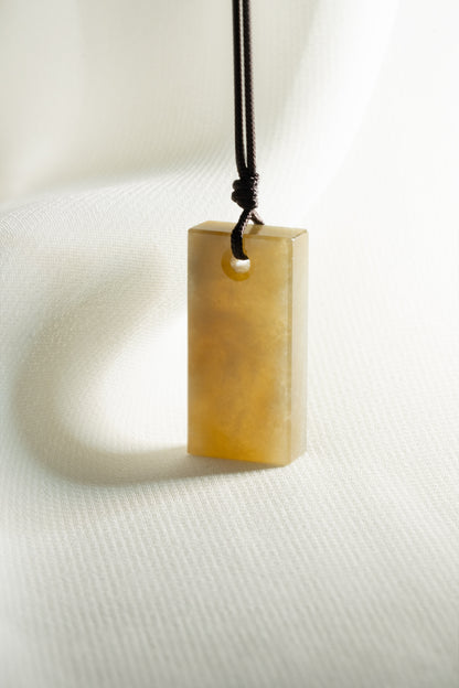 Brownish Yellow Jadeite Tag with White patches