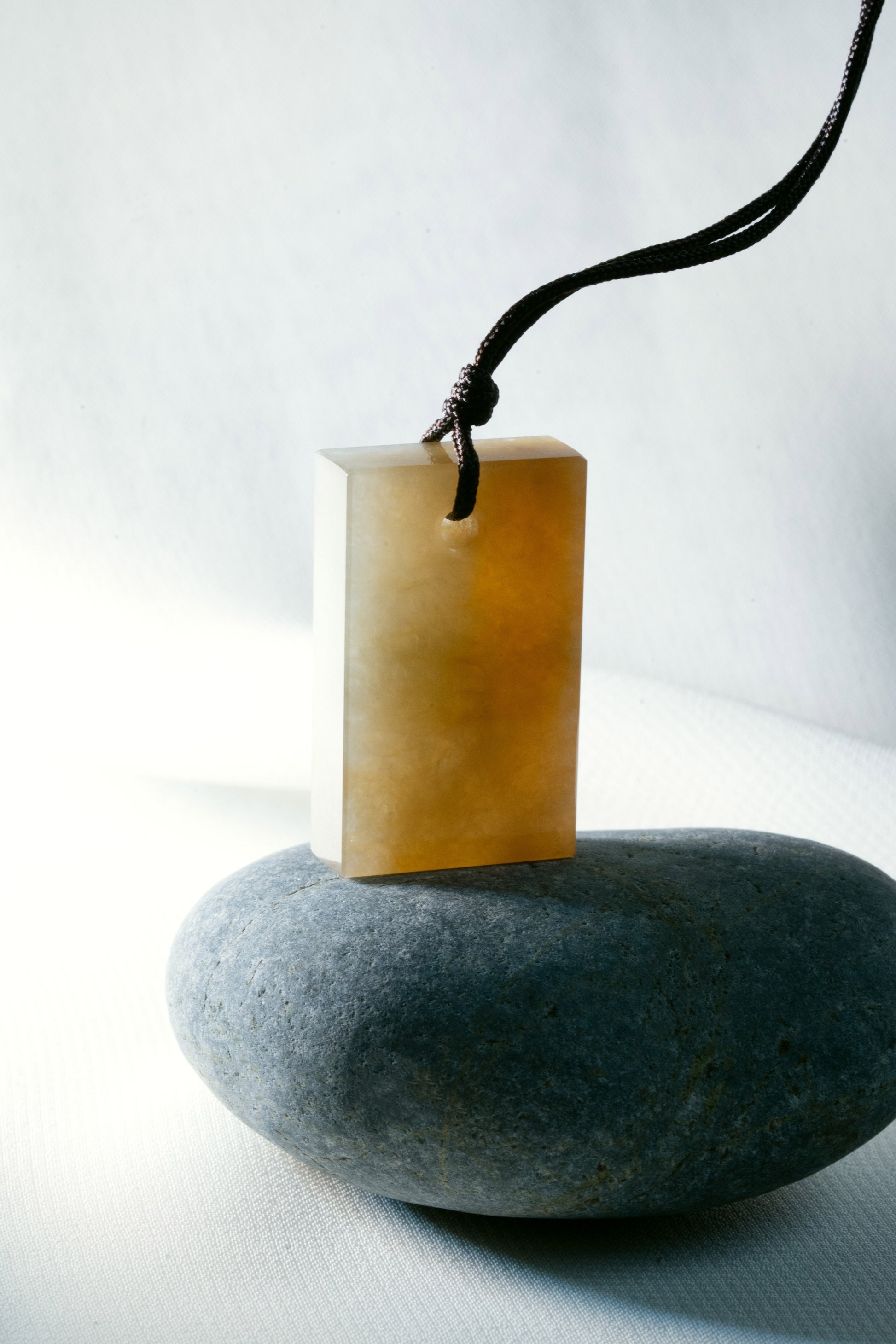Brownish Yellow Jadeite Tag with White Patches