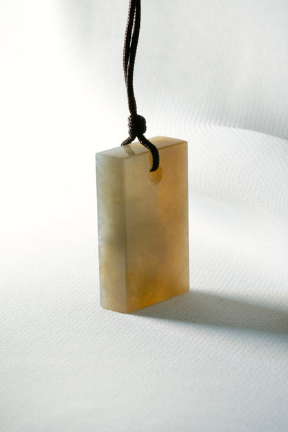 Brownish Yellow Jadeite Tag with White Patches