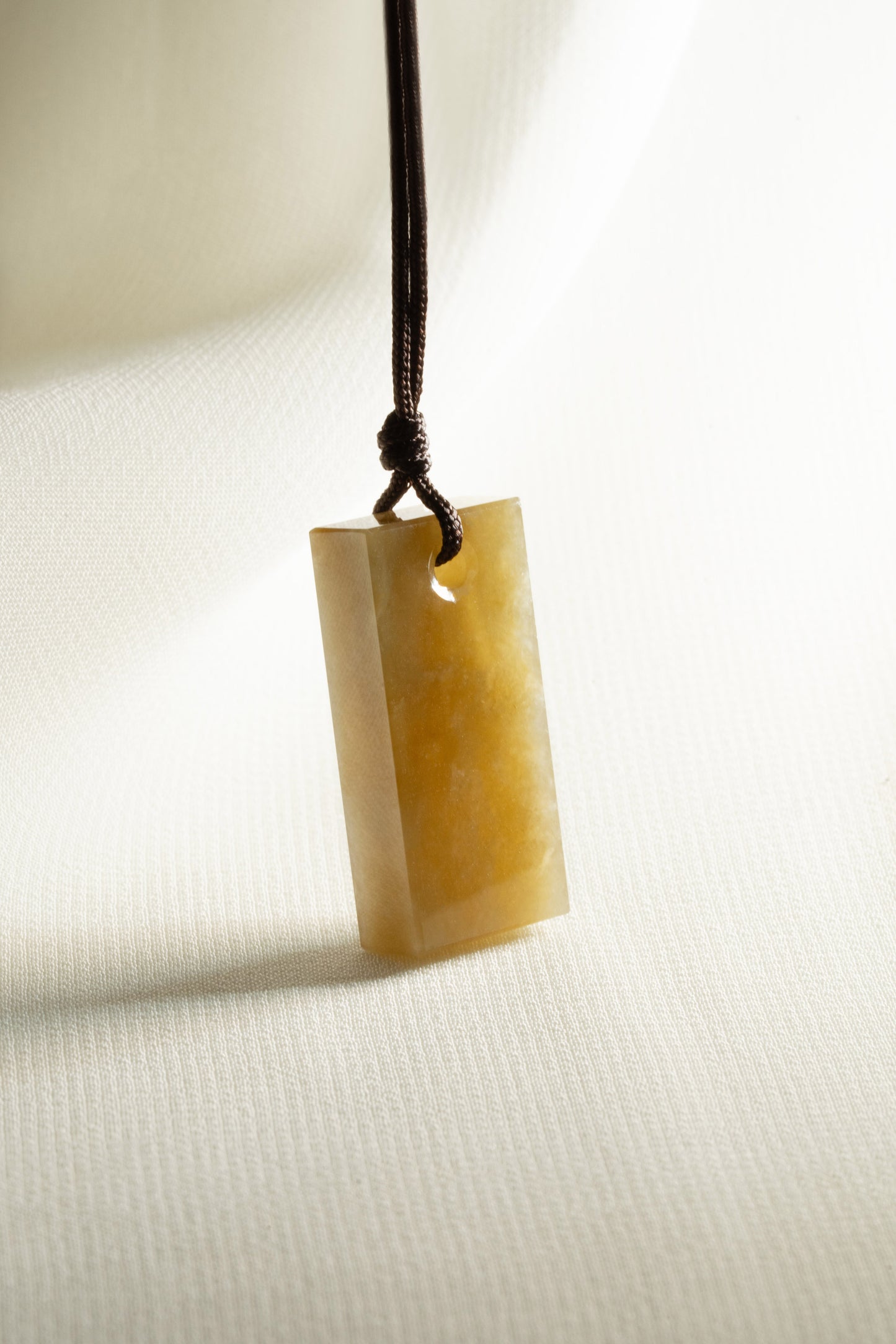 Brownish Yellow Jadeite Tag with White patches
