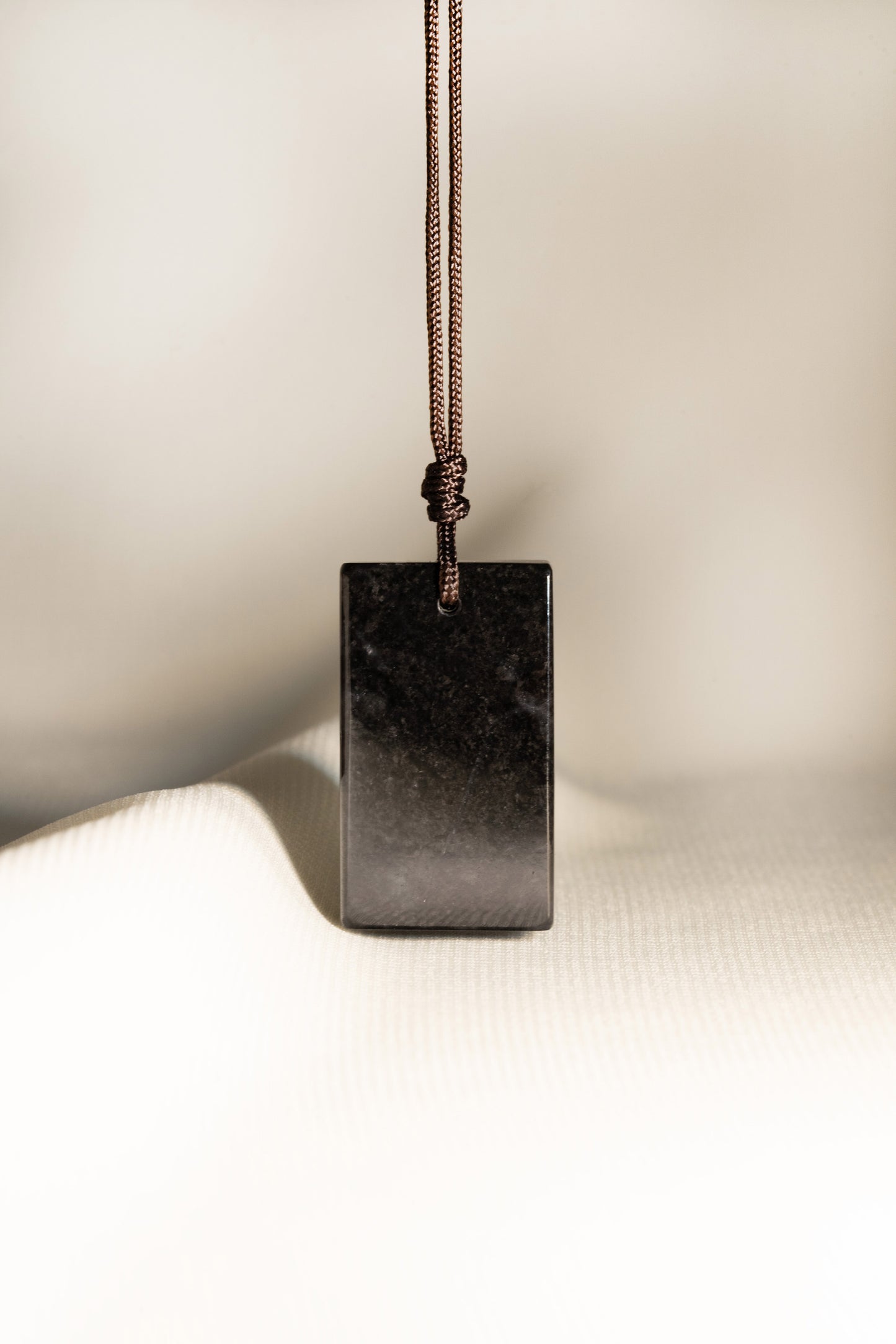 Black Jadeite Tag with White patches string with Adjustable Knot
