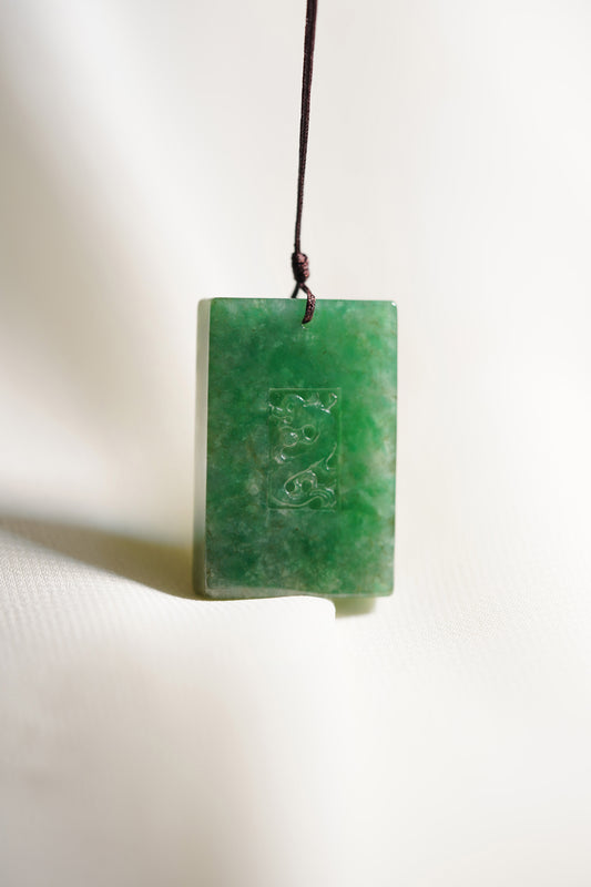 Medium Green Jadeite Engraved Dragon Tag with Pale Green patches