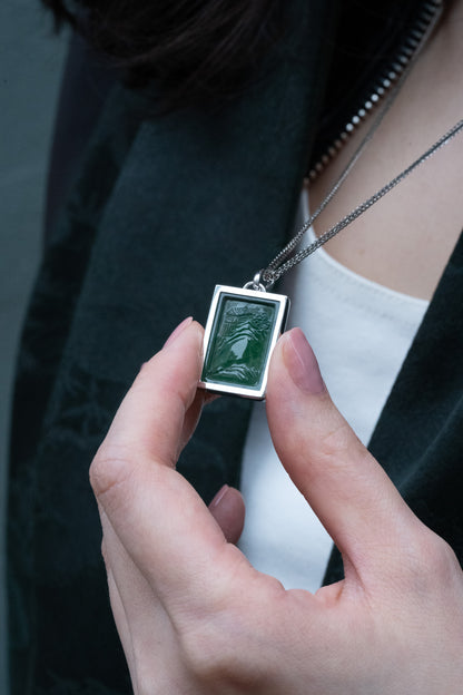 Carved Bluish Green Jadeite Tag with Platinum Frame hung on a 925 Silver Chain