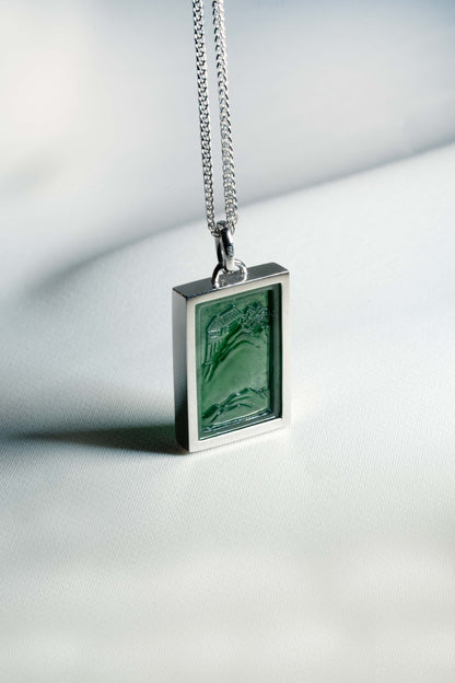 Carved Bluish Green Jadeite Tag with Platinum Frame hung on a 925 Silver Chain