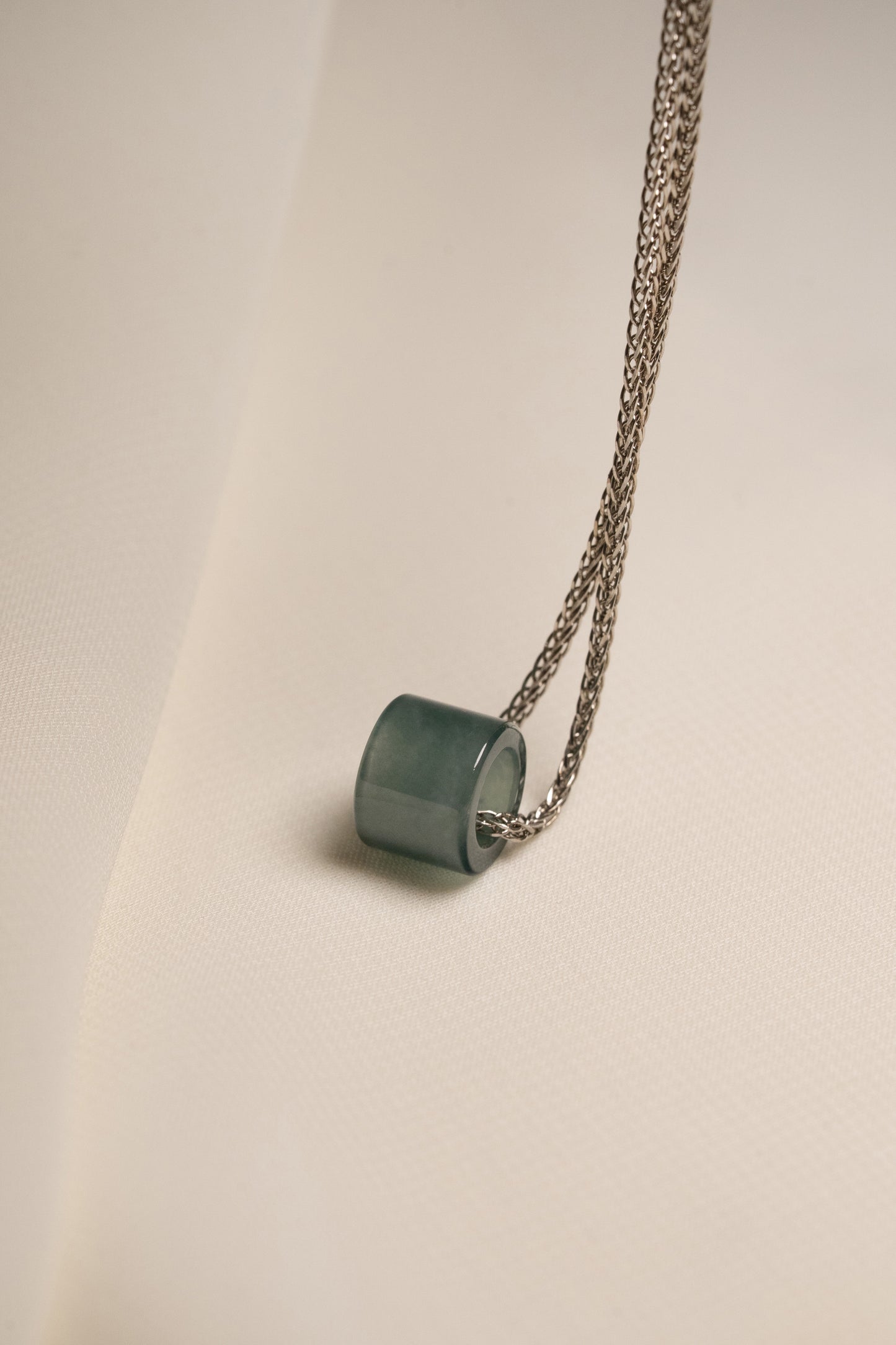 Small Intense Bluish Green Jadeite Ring Pendant hung on a 925 Silver Chain